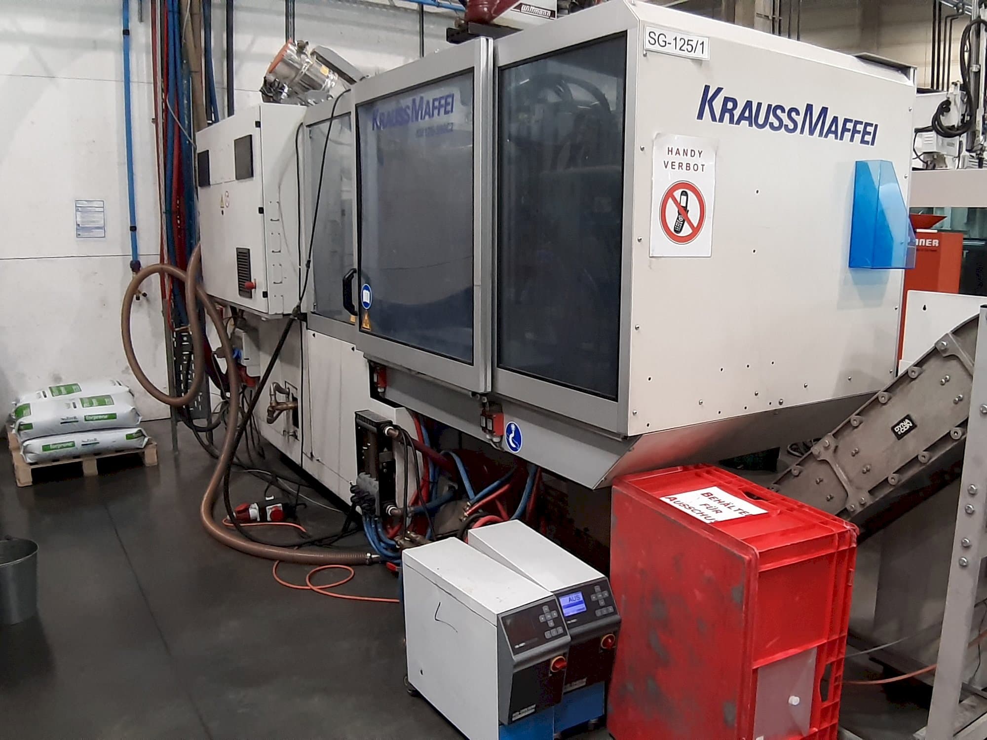 Front view of Krauss Maffei 125 - 390 CX machine