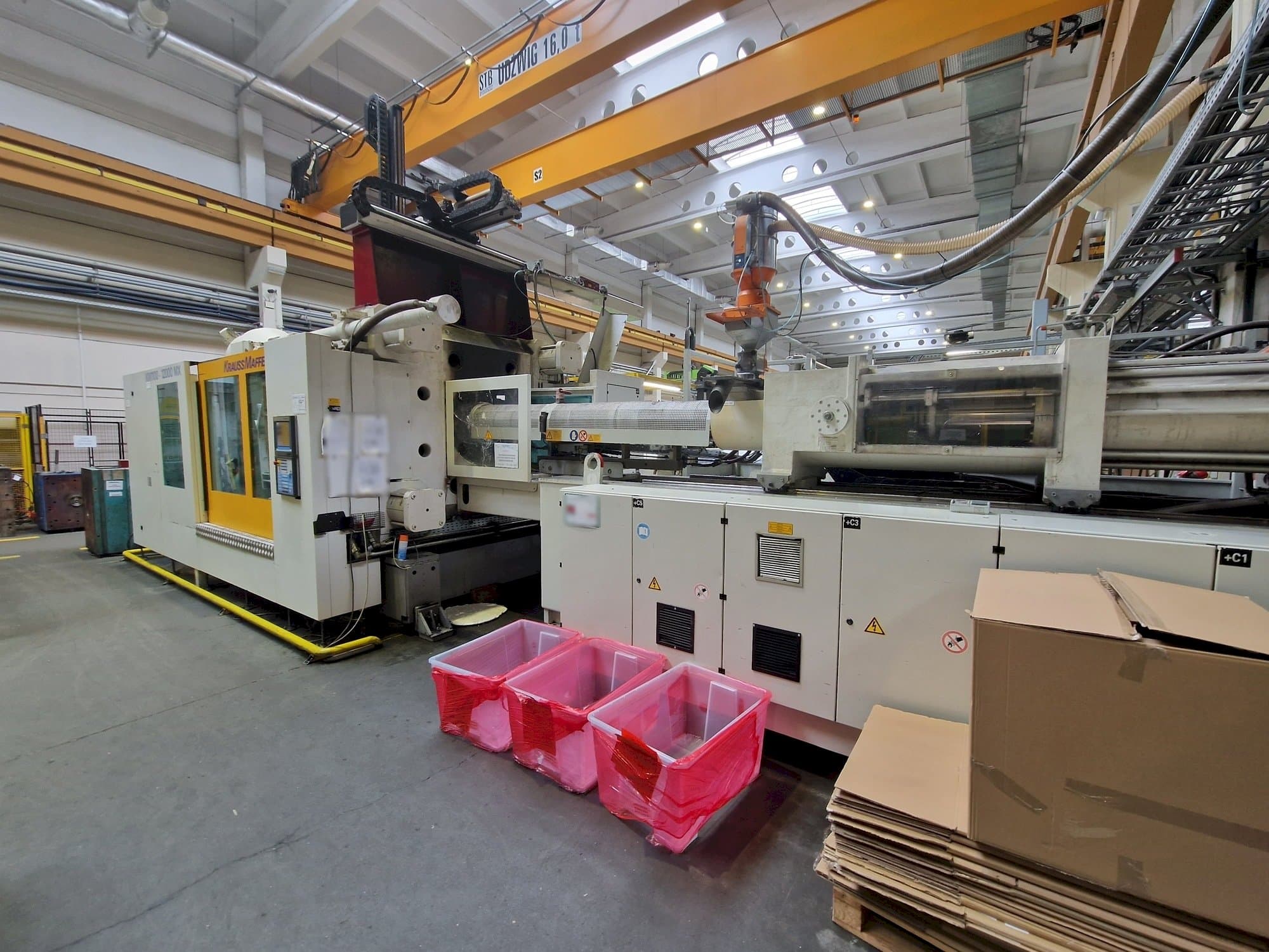 Front view of Krauss Maffei 1100-12000 MX machine