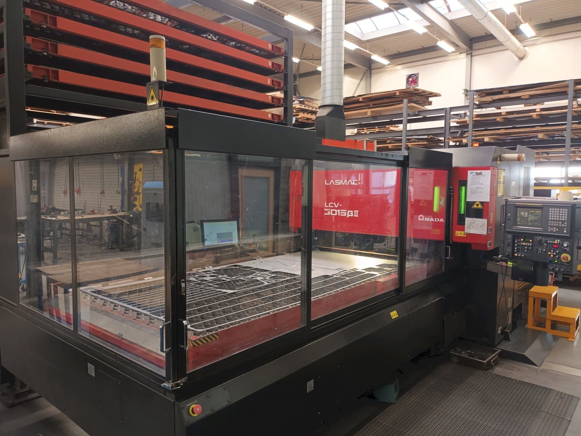 Front view of AMADA LCV 3015 3KW + Automation/storage machine