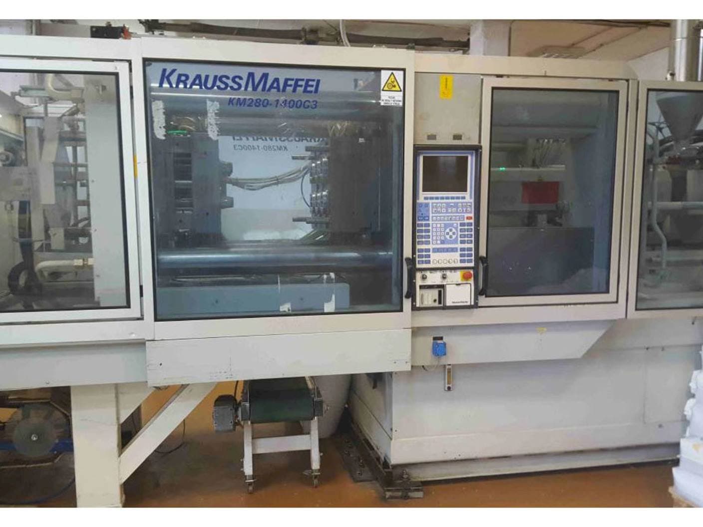 Front view of Krauss Maffei KM 280-1400 C3 machine