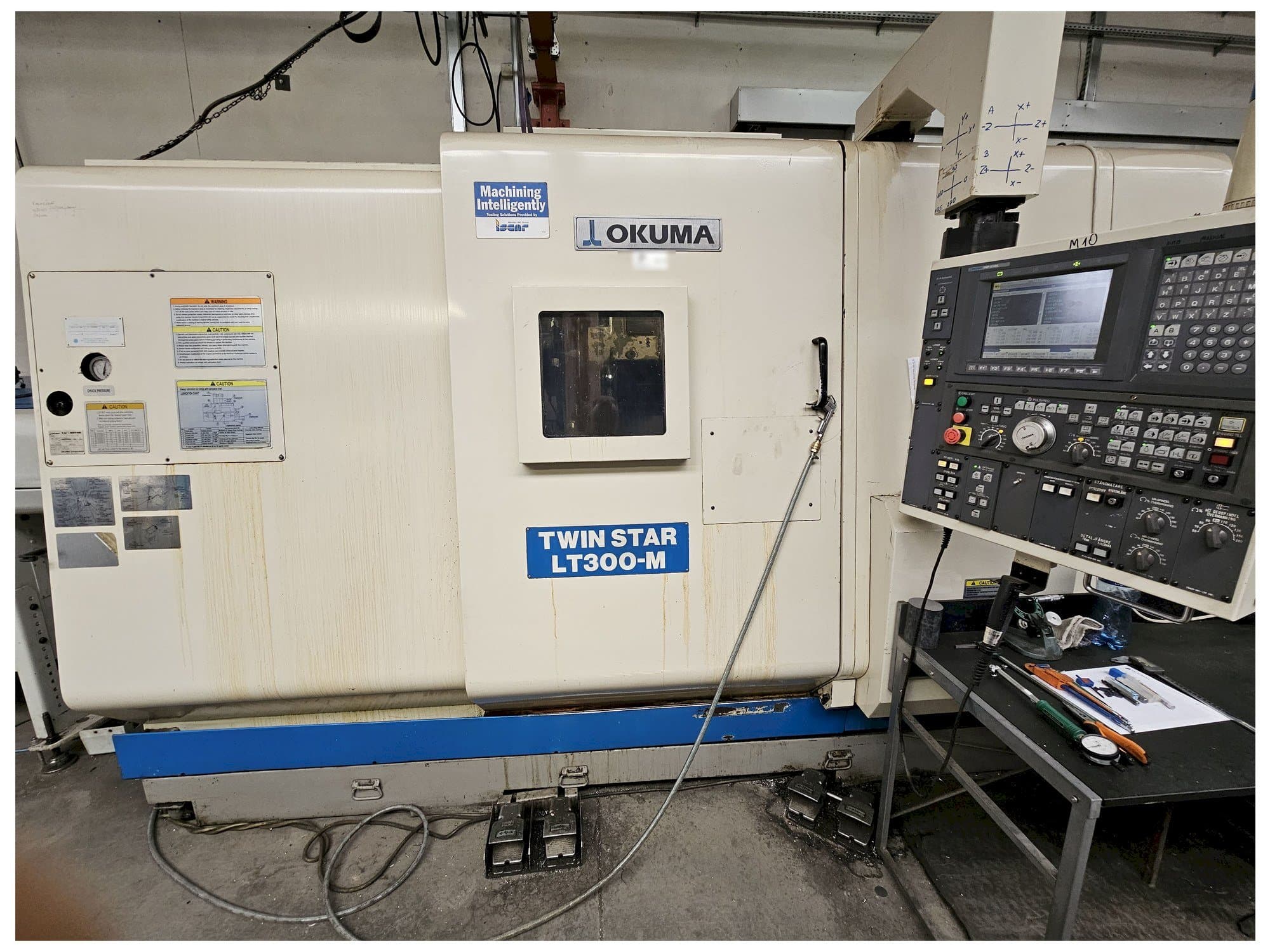 Front view of Okuma LT300-M machine