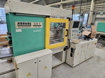 Front view of Arburg 320 C 500-100 + Multilift H with B-Axis  machine