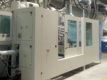 Front view of Krauss Maffei 1300-14000 MX IMC  machine
