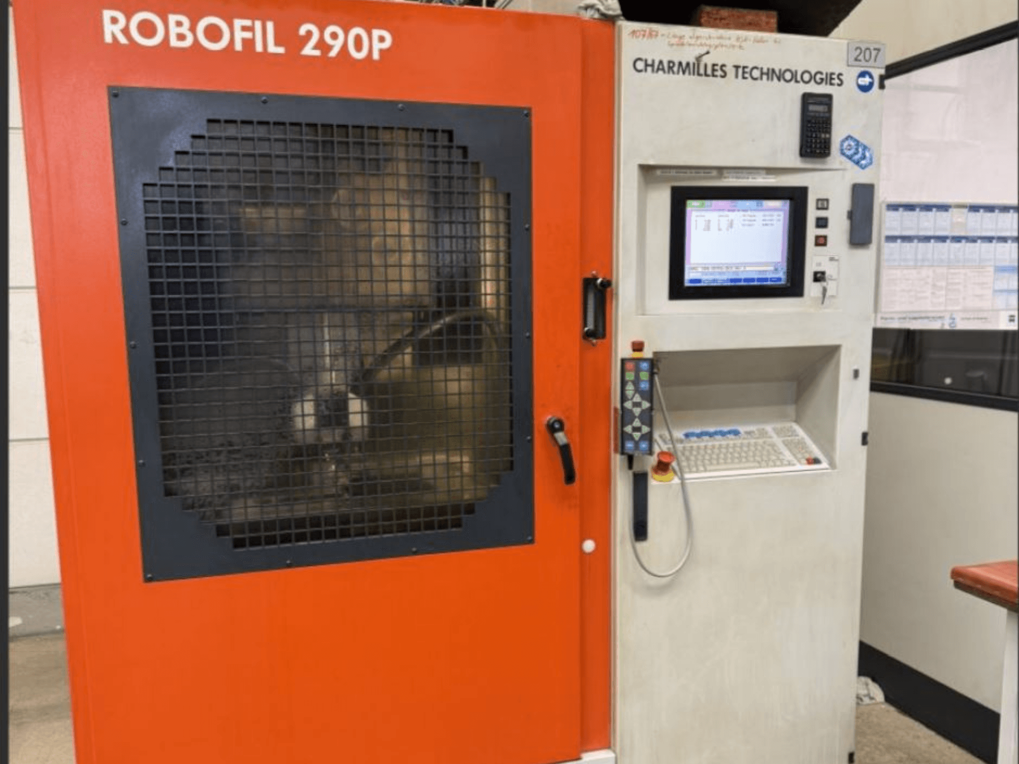 Front view of CHARMILLES TECHNOLOGIES Robofil 290P wire EDM machine with control panel and grid-guarded working area.