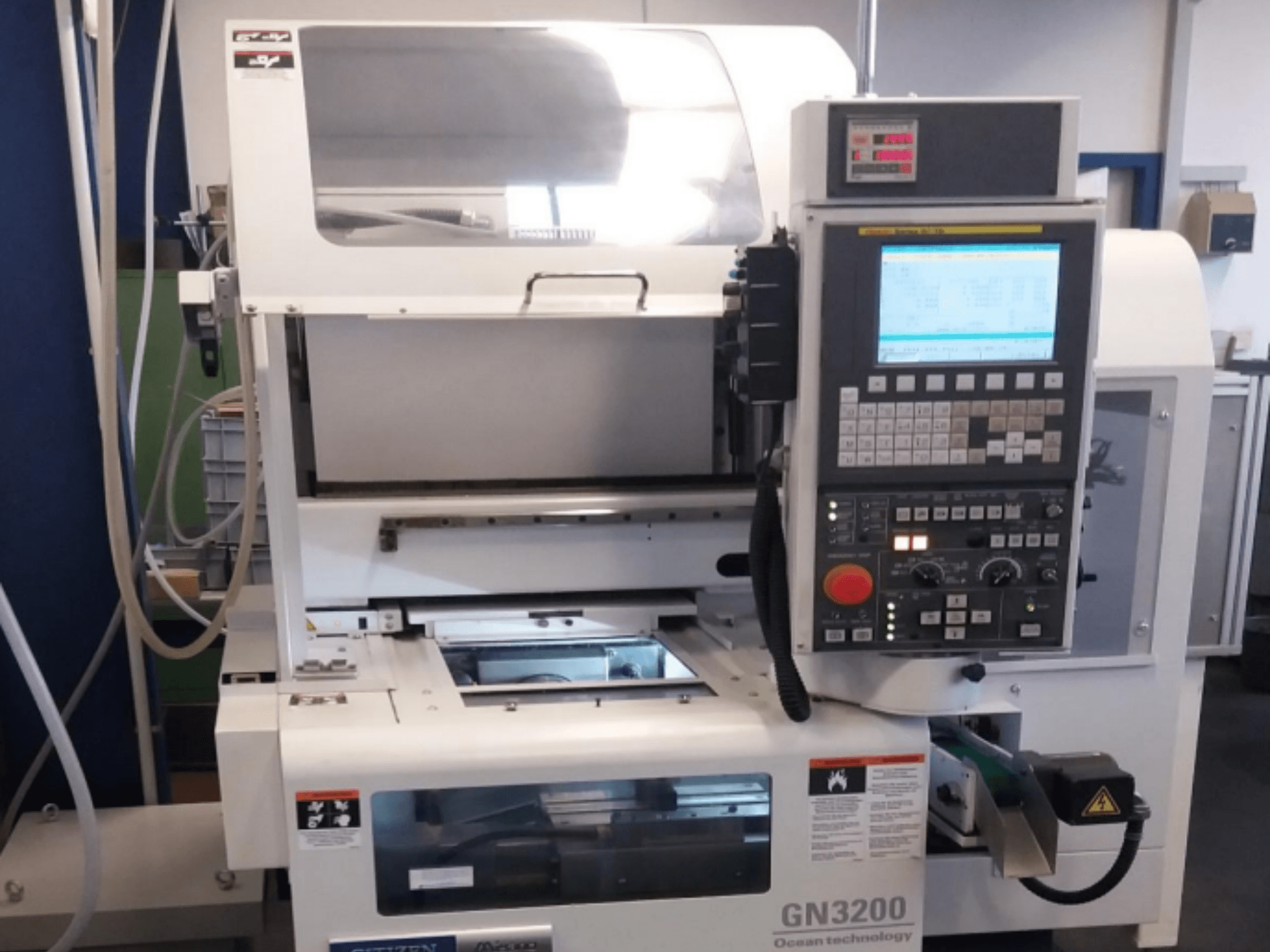 Citizen MIYANO GN 3200 horizontal turning machine, front view, showcasing control panel and operational components.