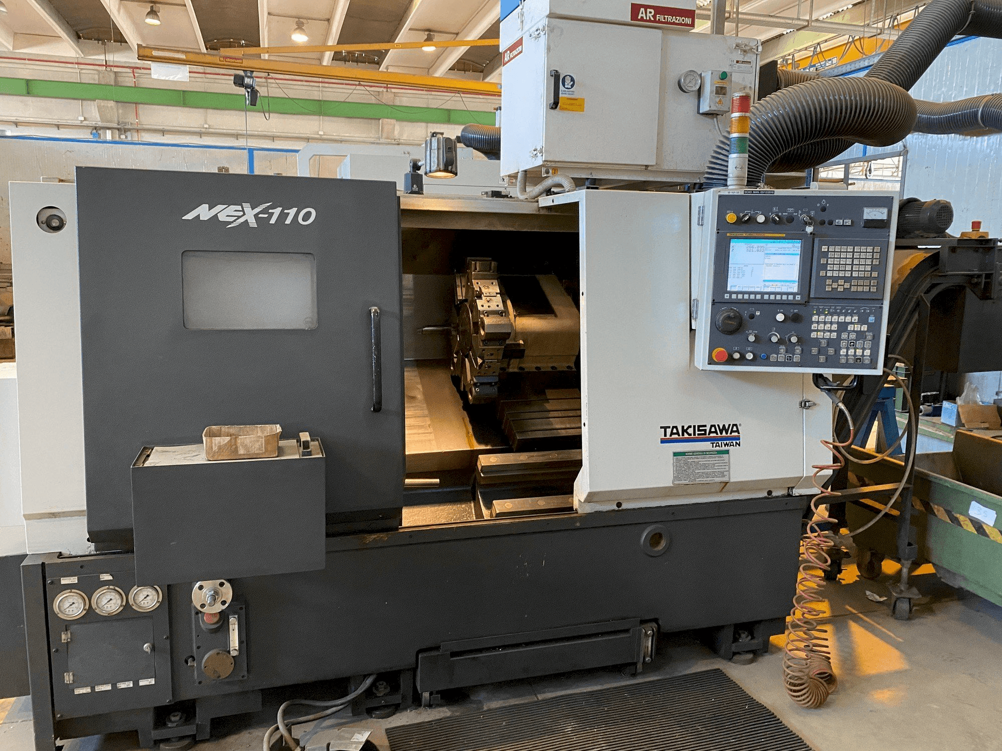 Front view of Takisawa NEX-110 machine