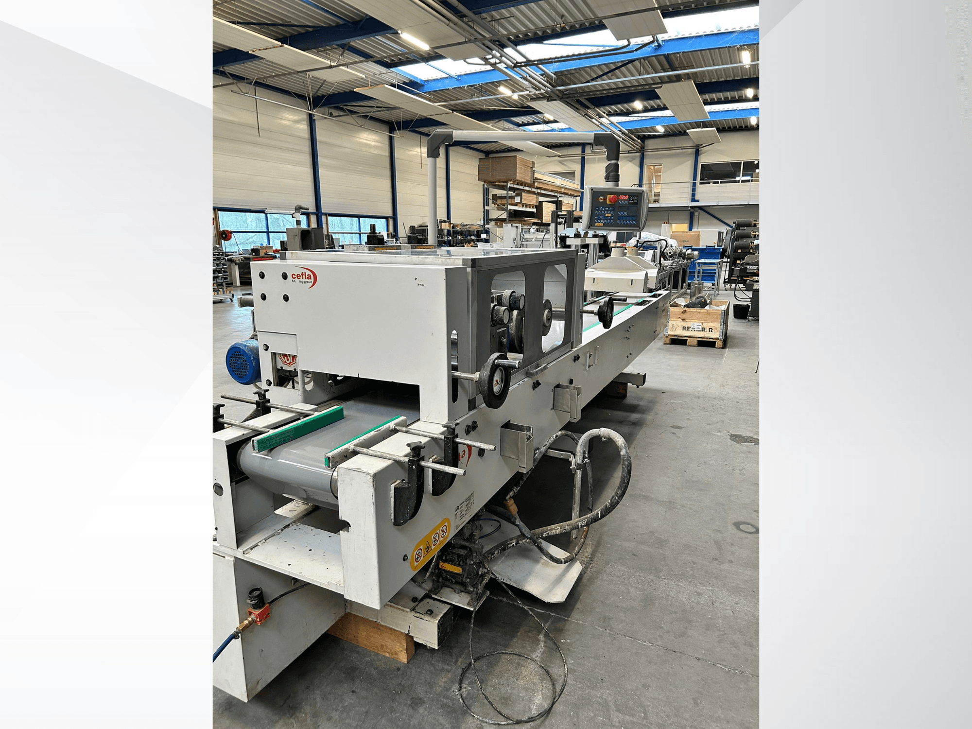 Front view of CEFLA Smartparquet MRF-2VS/300 wood machine, showcasing control panel and conveyor with green rollers.