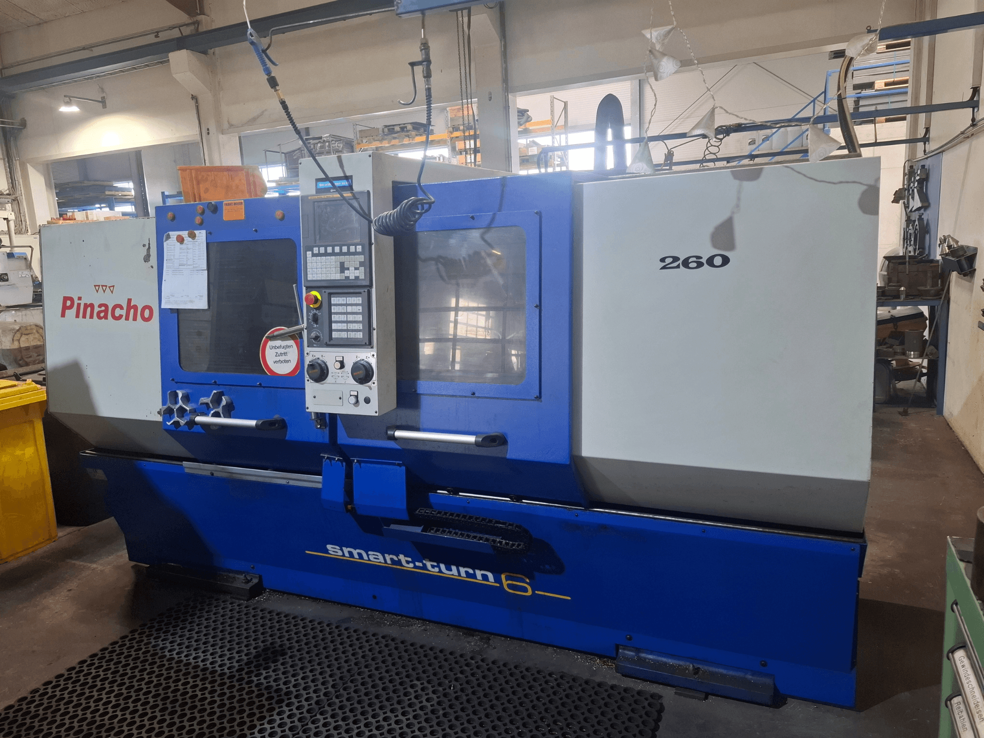 Pinacho Smart-turn6 260 horizontal turning machine, front view with control panel and labels visible.