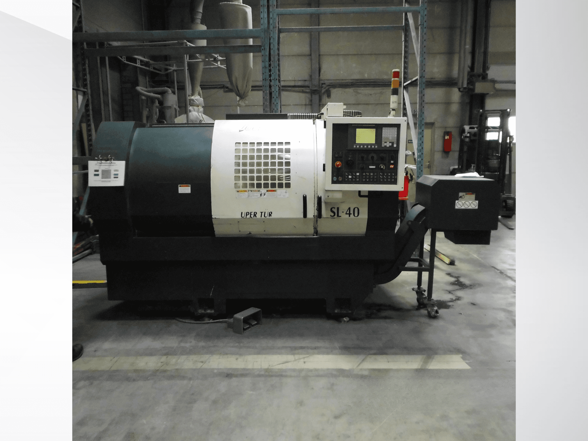 Horizontal turning machine Johnford SL-40, side view, showing control panel, cooling system, and sturdy base.