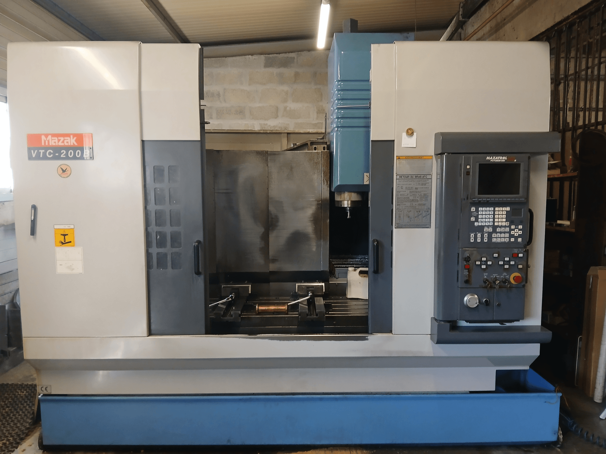 Mazak VTC 200 B vertical machining centre in a front view, showcasing control panel, spindle, and work area.