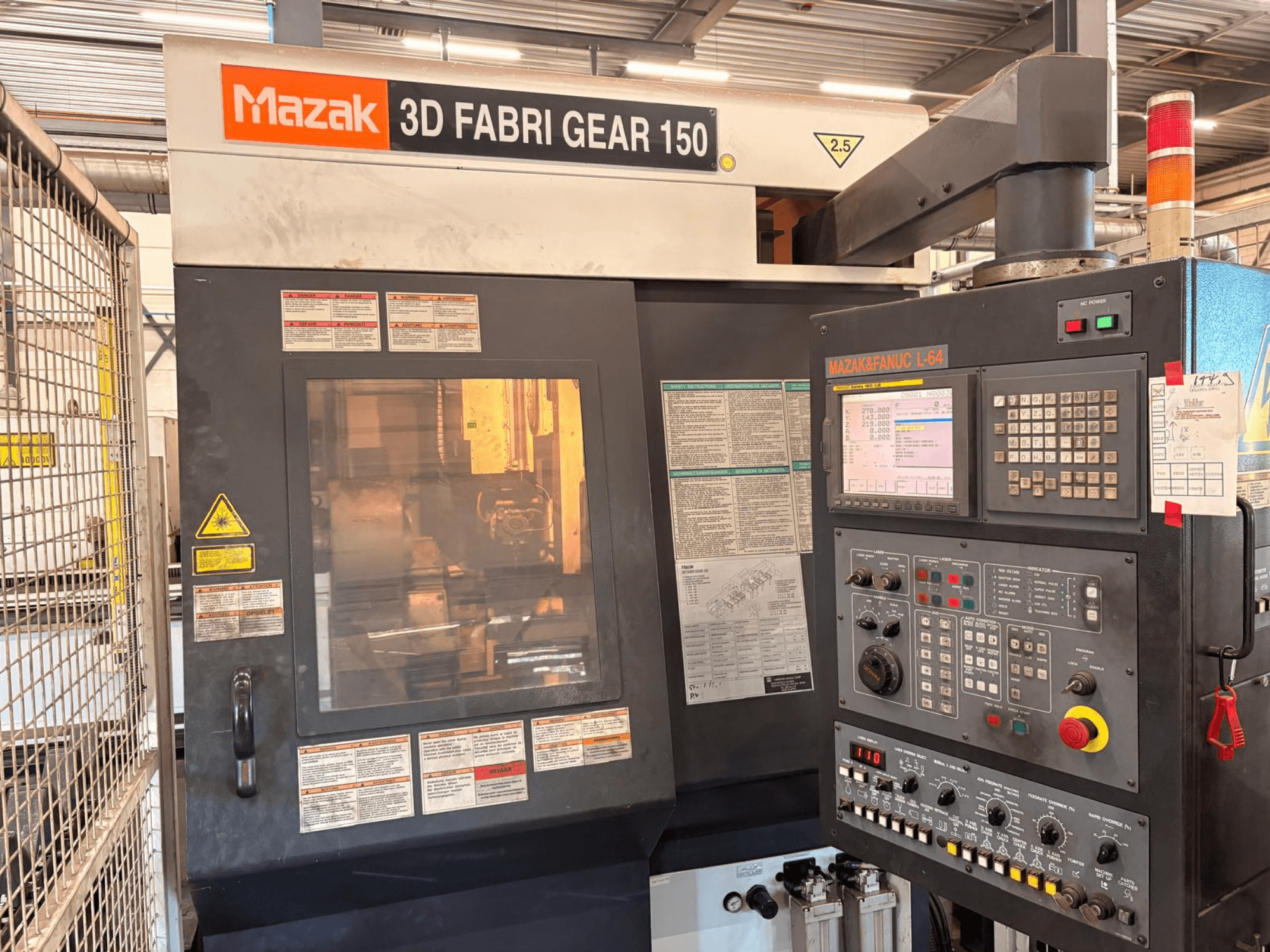 Mazak 3D Fabri Gear 150 tube cutting machine, front view showing control panel, safety labels, and operational interface.