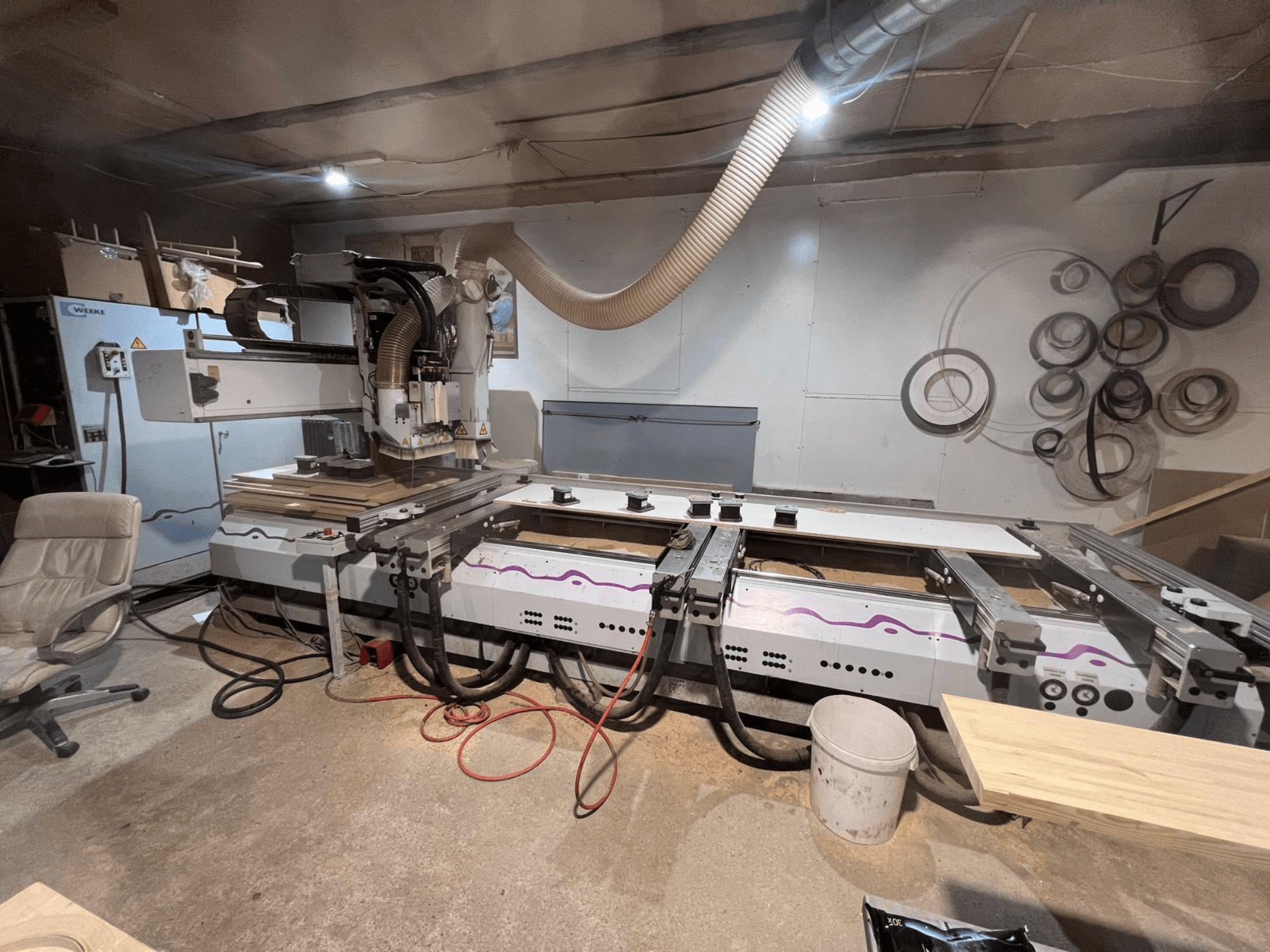 CNC Wood Machining Centre Weeke OPTIMAT BP 120 in workshop, front view with wood pieces and tools visible on surface.