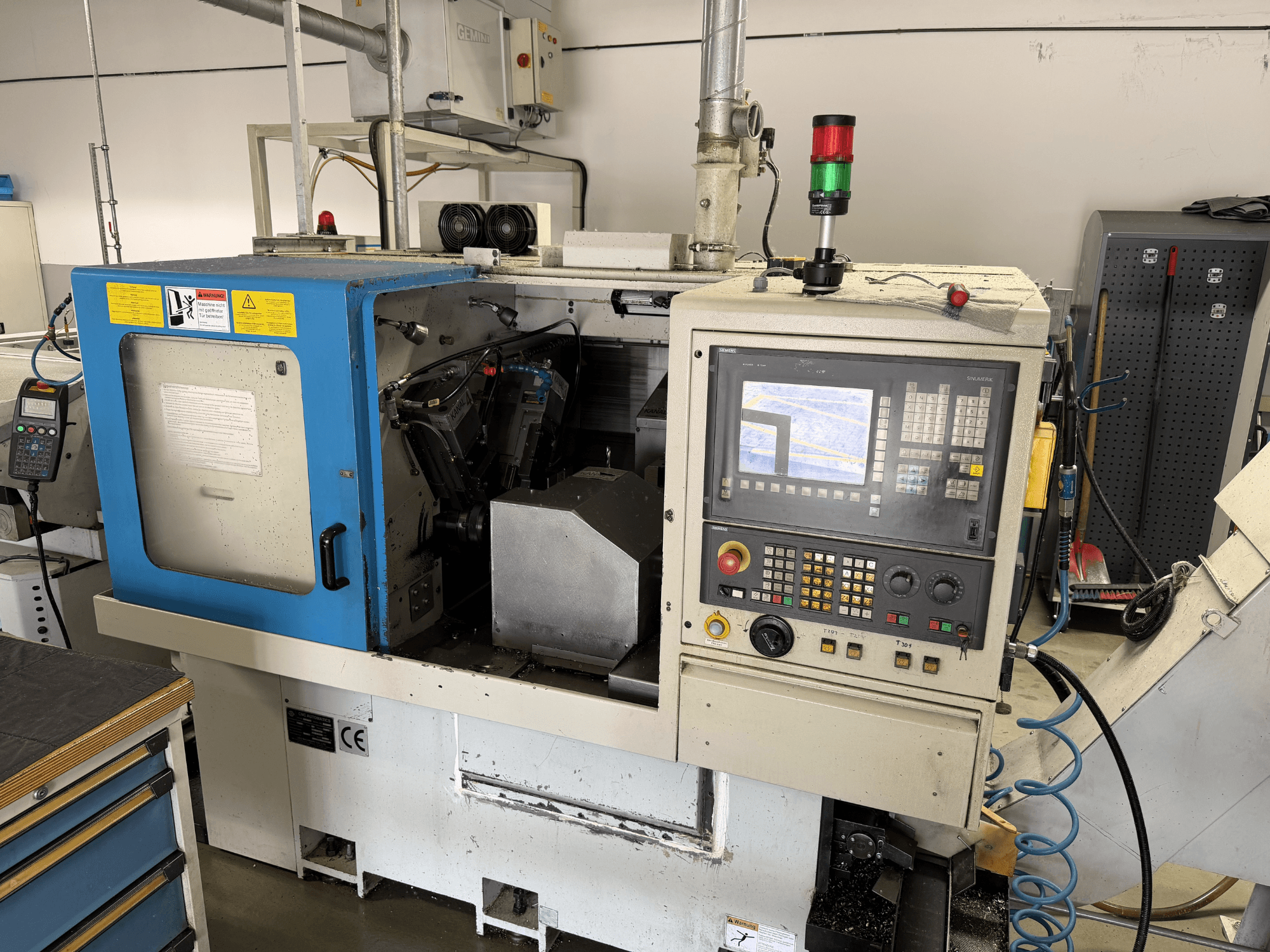 LICO LNT 65 S horizontal turning machine in a side view, showing control panel, operating area, and safety features.