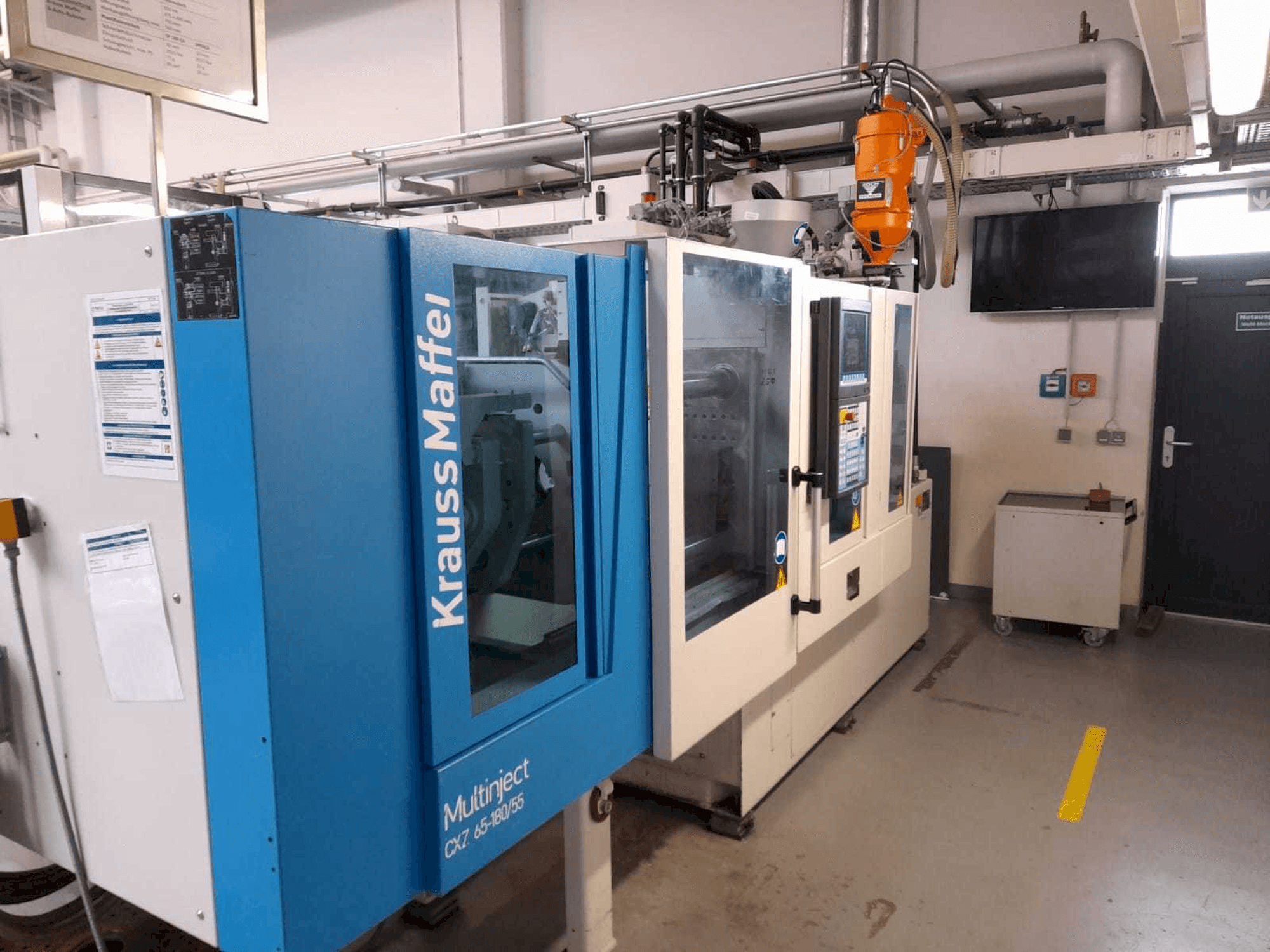 Front view of Krauss Maffei KM 65/80 CX machine