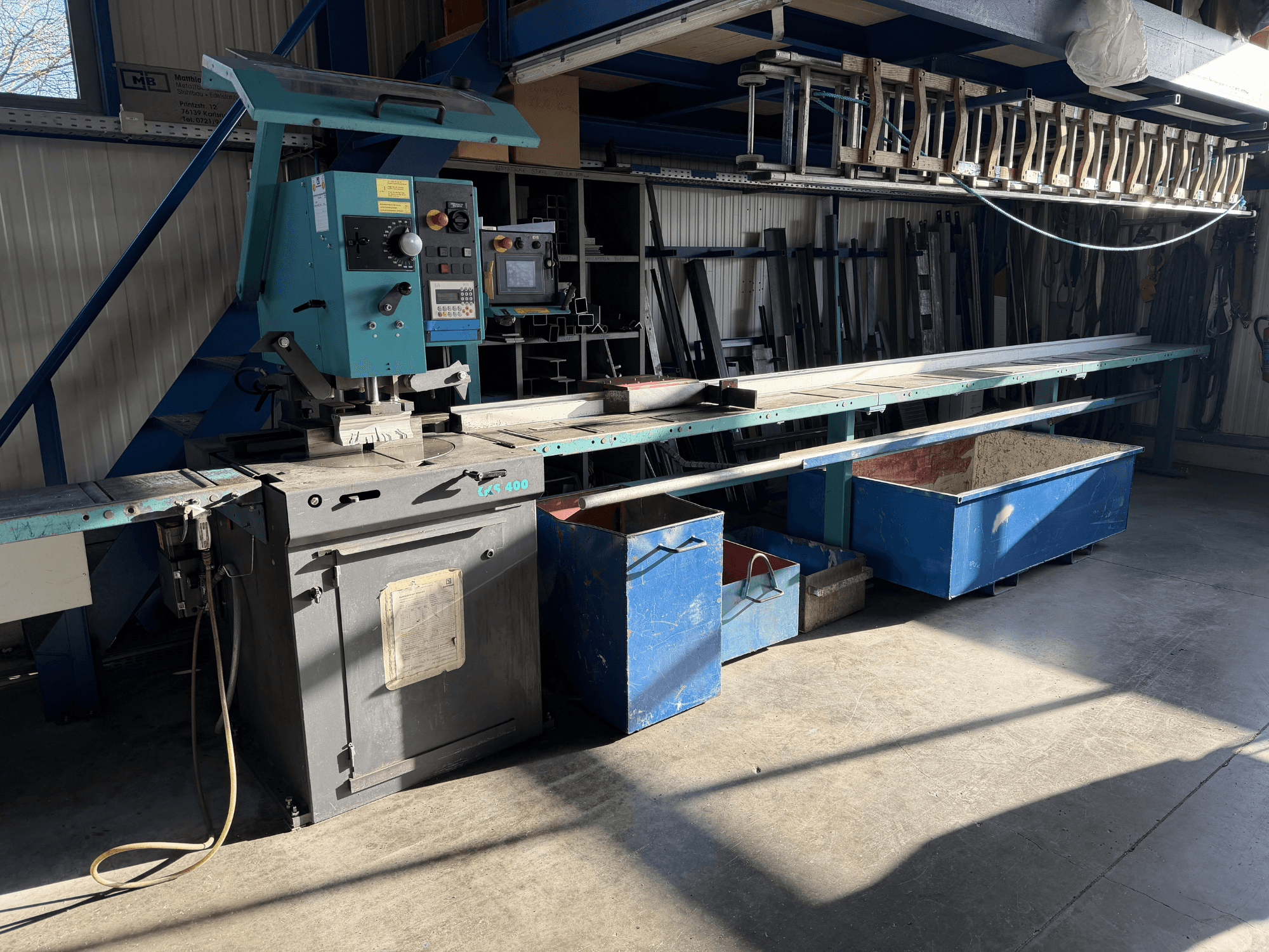 KALTENBACH KKS 400 circular metal saw in a workshop, front view with controls and metal storage bins visible.