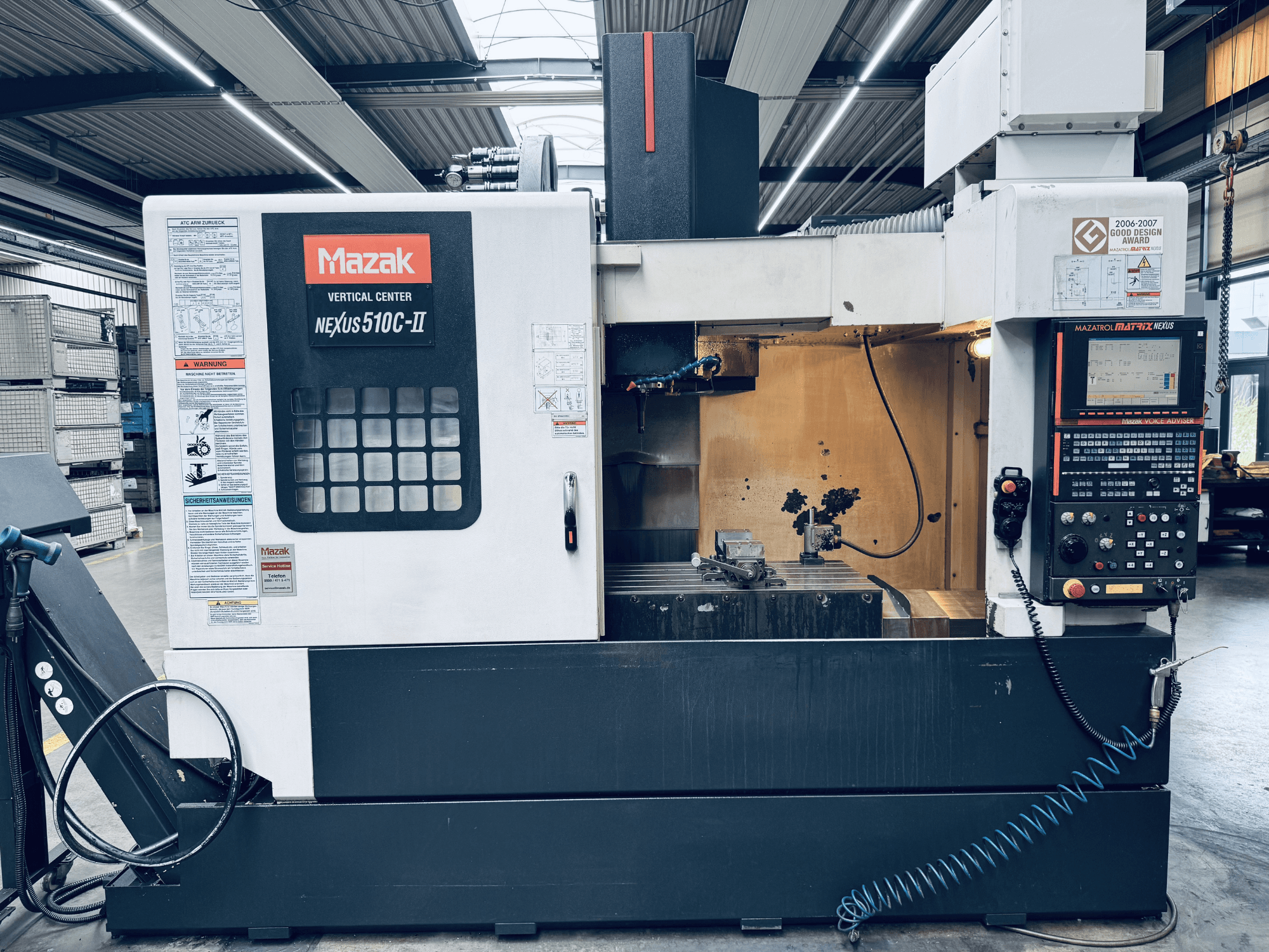 Mazak Vertical Center Nexus 510C-II, front view, showing control panel, work area, and operational features in a workshop setting.