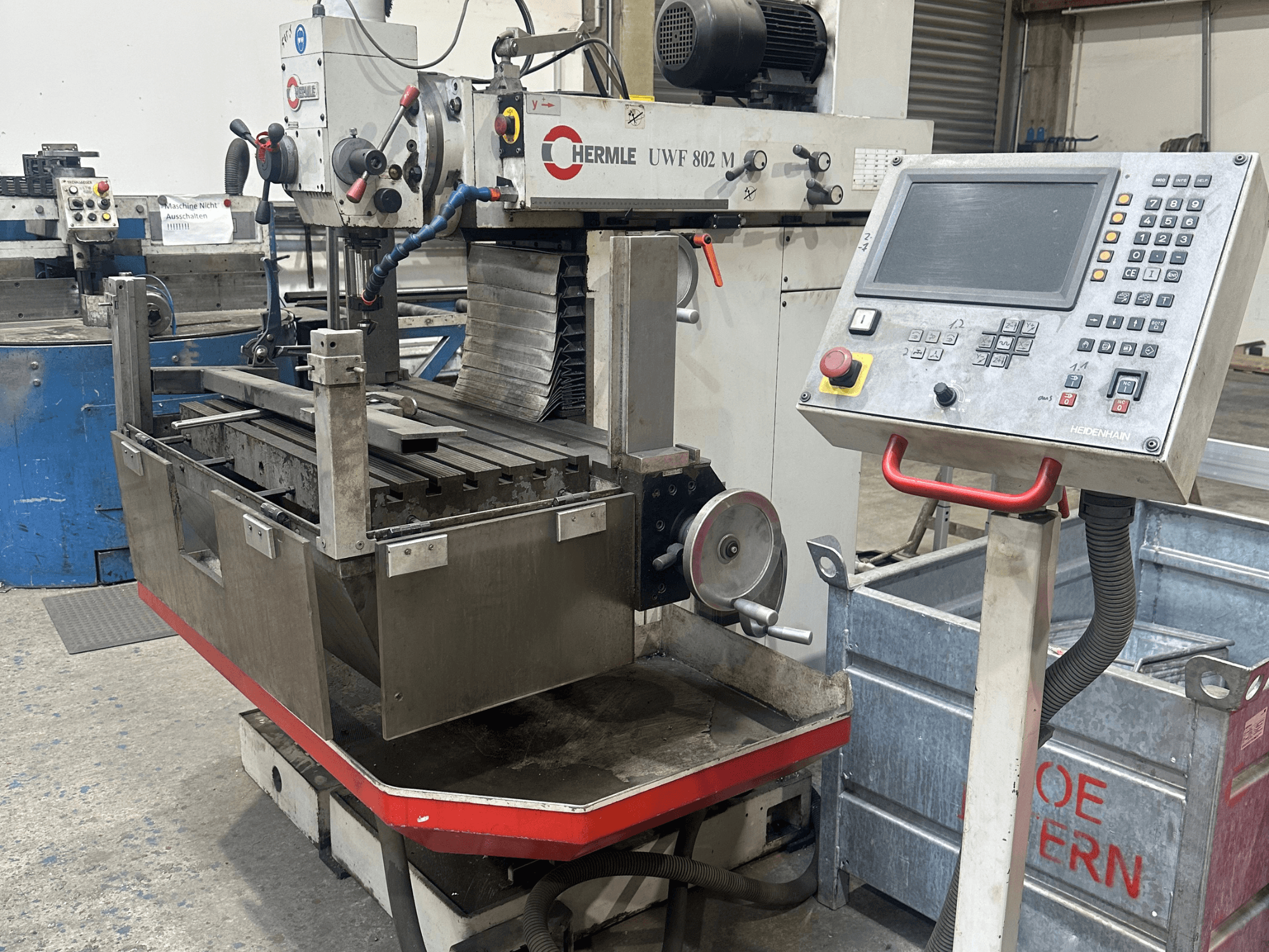HERMLE UWF 802 M universal machining center in front view, showcasing its control panel and machining table.