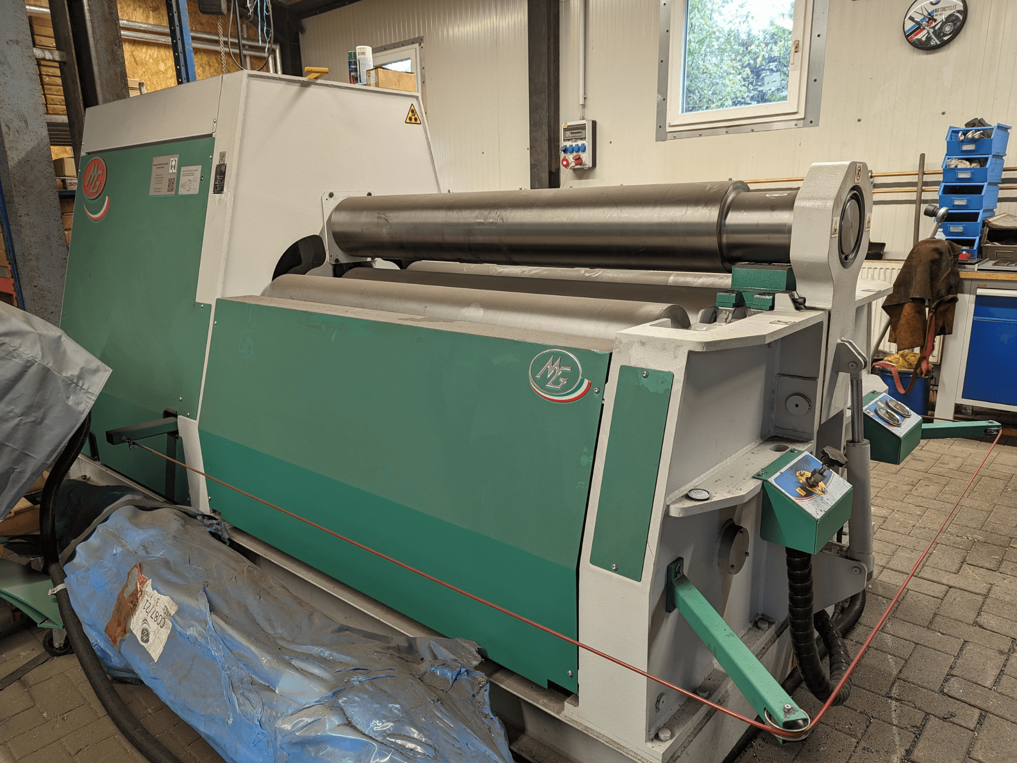 MG Roll Bending Machine Model MG4R1520C in green and gray, side view showcasing three metal rolls and control panels.