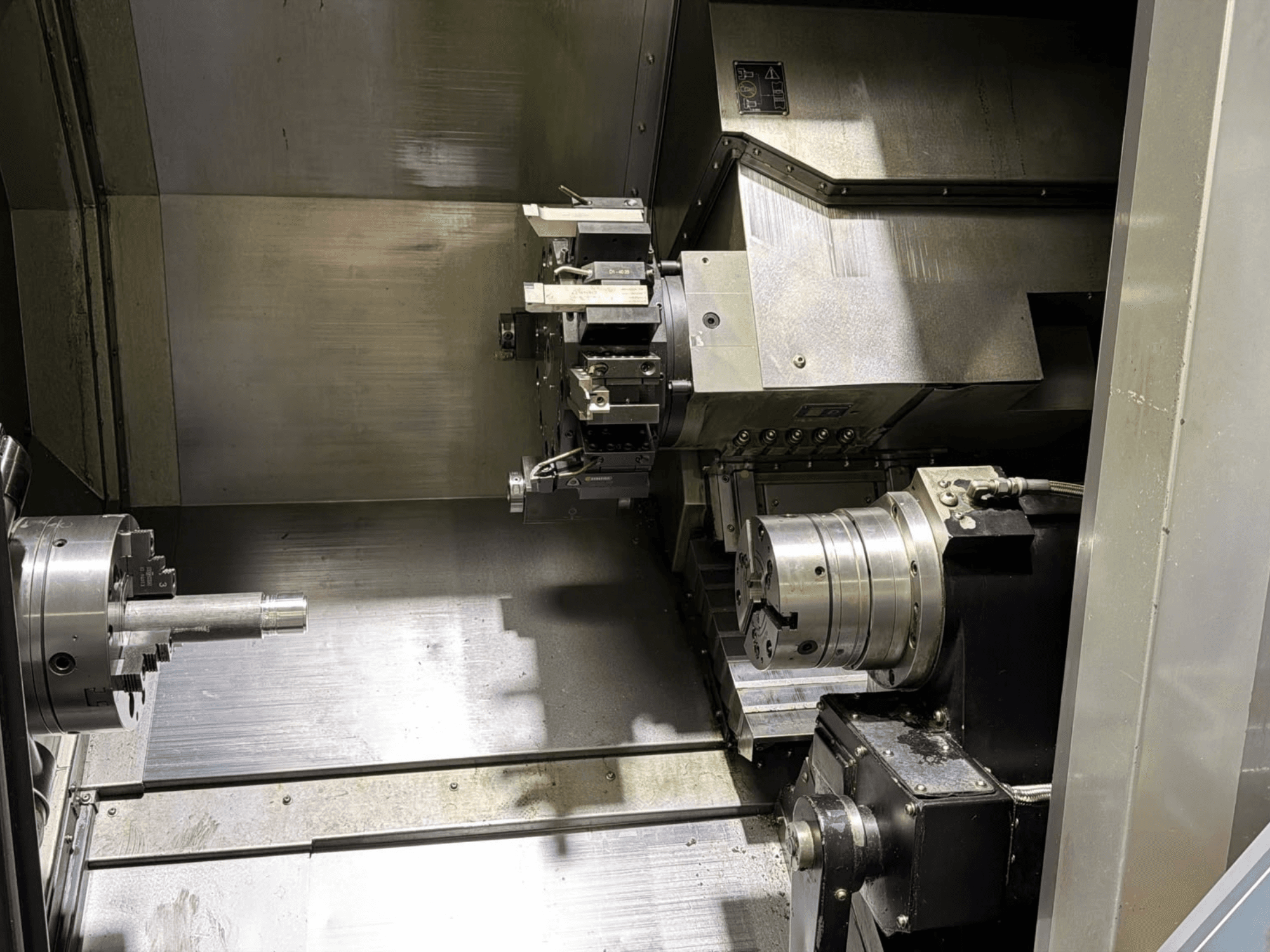 Hurco TMX8MYS Turn-Mill Centre interior view showing spindle, chuck, and tool holder with metal surfaces.