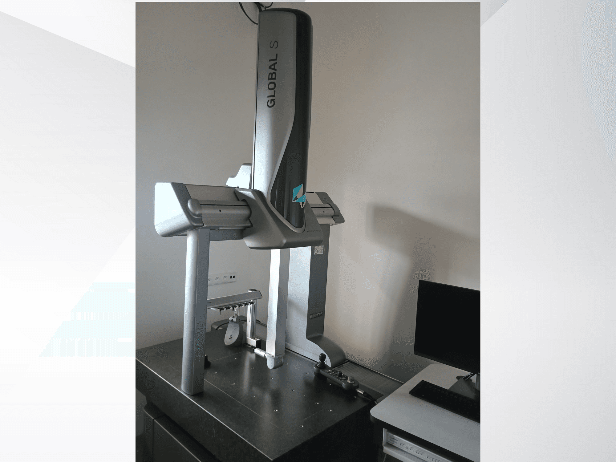 Global S coordinate measuring machine shown from the front, featuring a sleek, silver design on a dark surface.