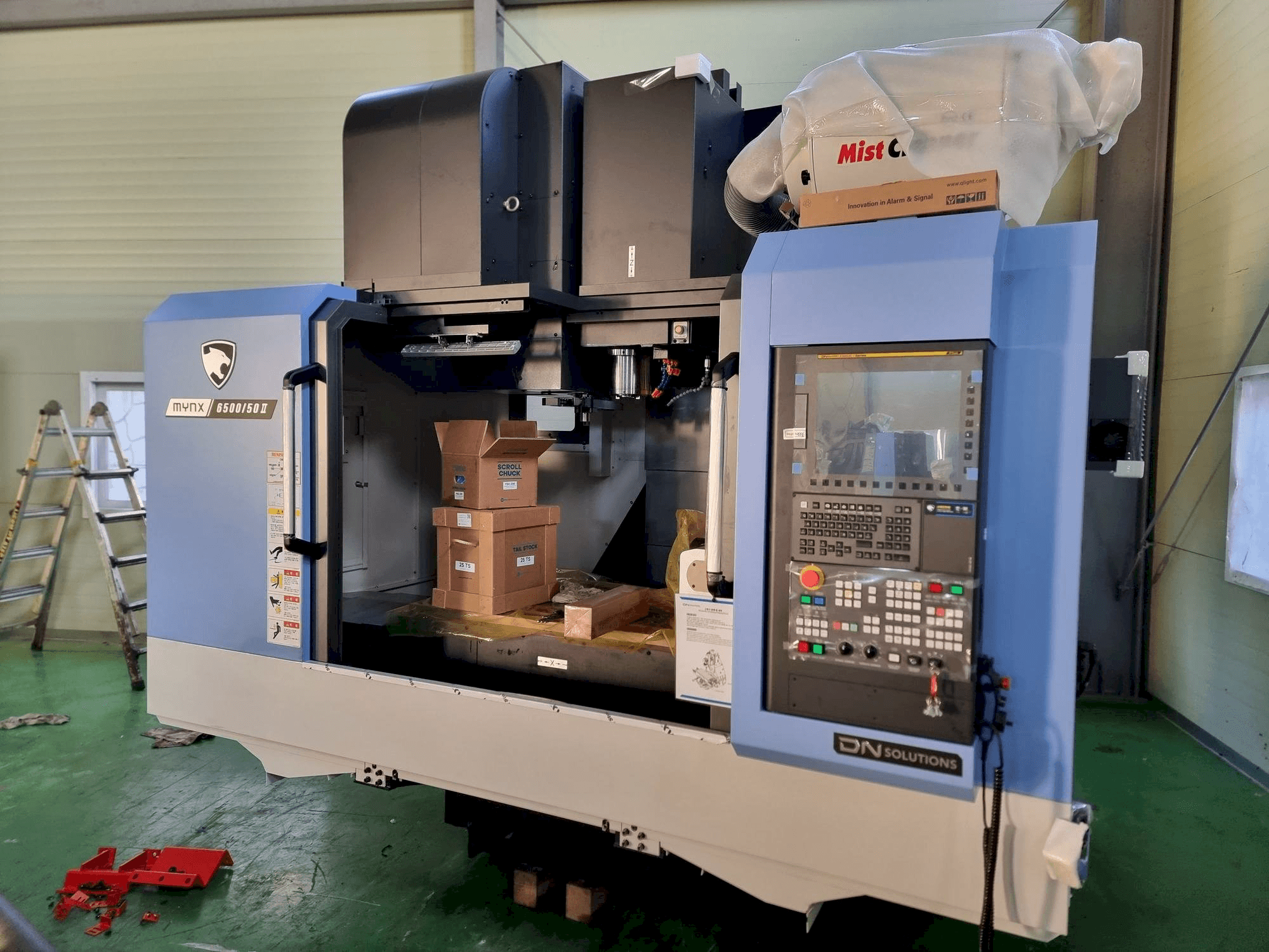 Front view of DN SOLUTIONS MYNX 6500/50 machine