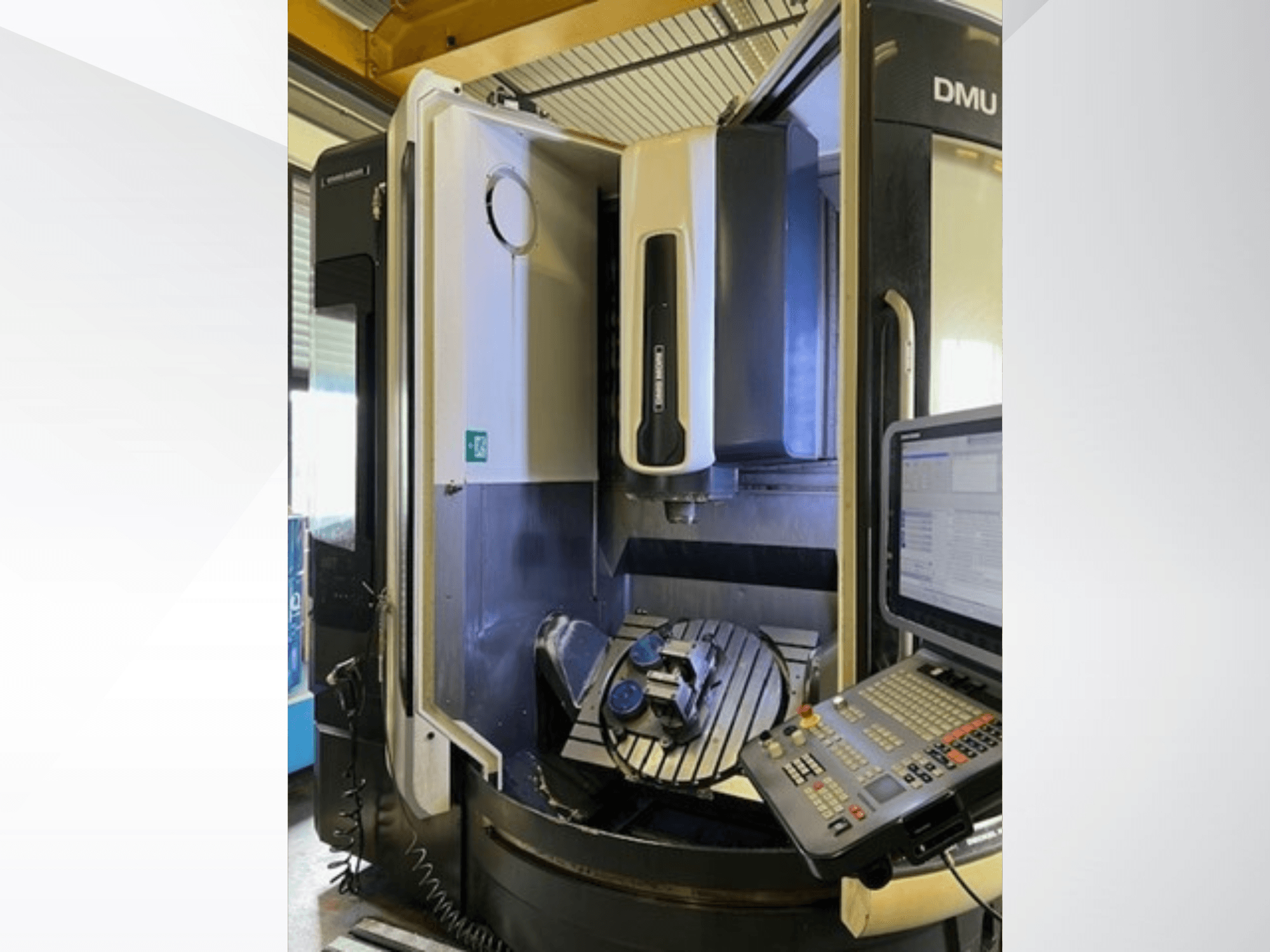 DMG MORI DMU 75 Monoblock universal machining center, front view, showcasing control panel and workpiece on the table.