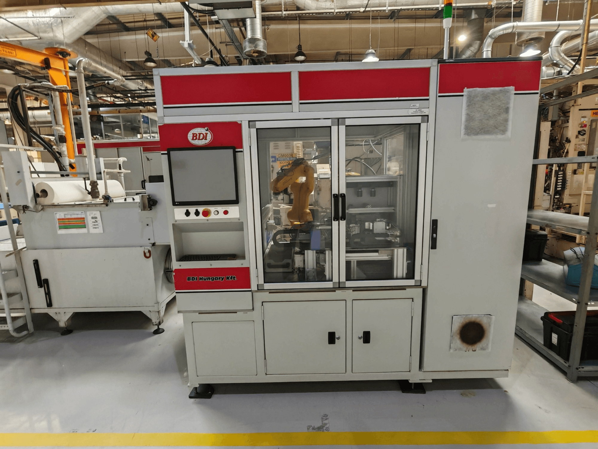 KOYO 4515C Centerless Grinding Machine, front view with control panel and robotic arm visible, in a factory setting.