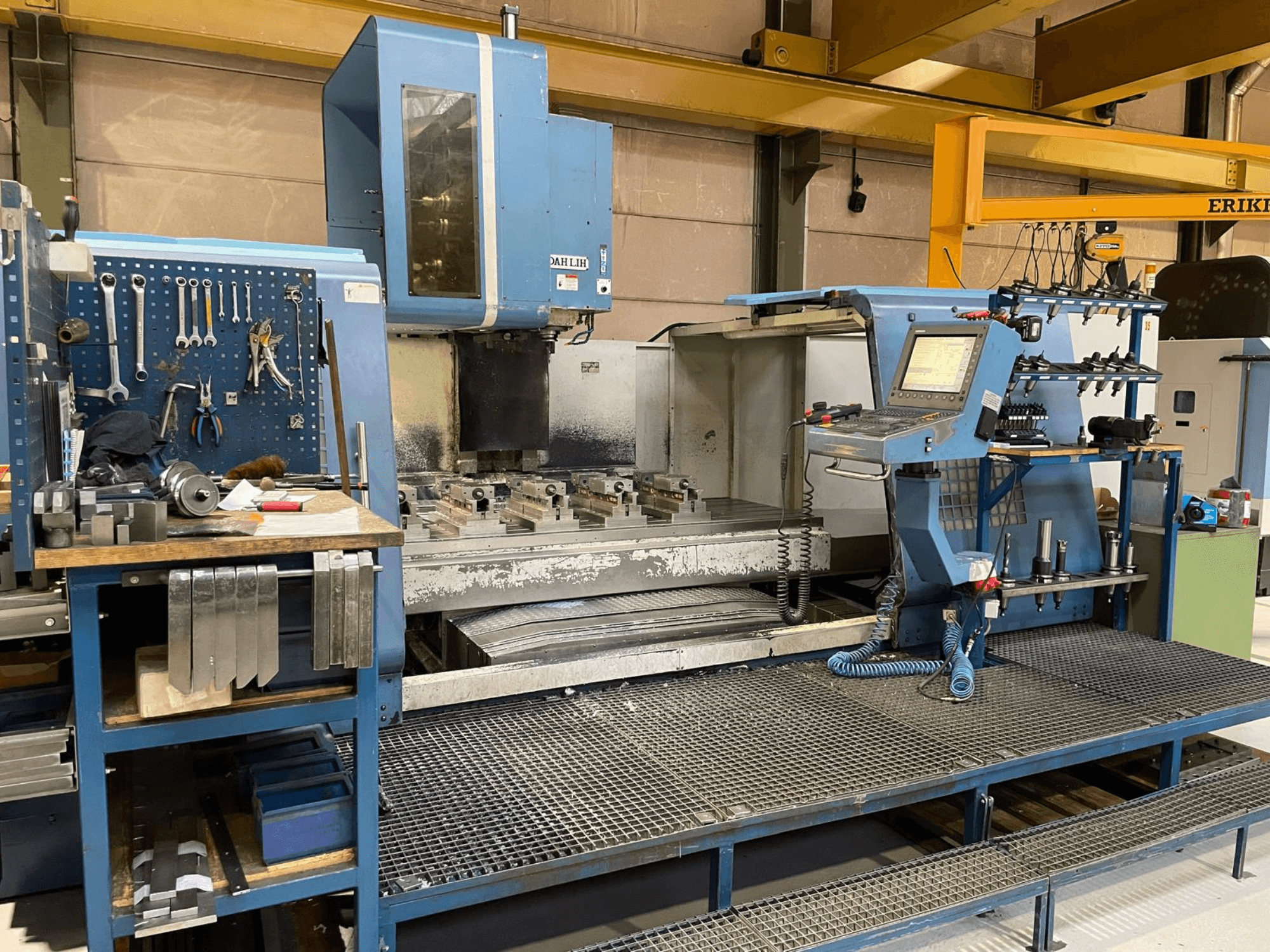 DAH LIH MCV2600 vertical machining center front view, showcasing control panel, work table, and tool storage area.