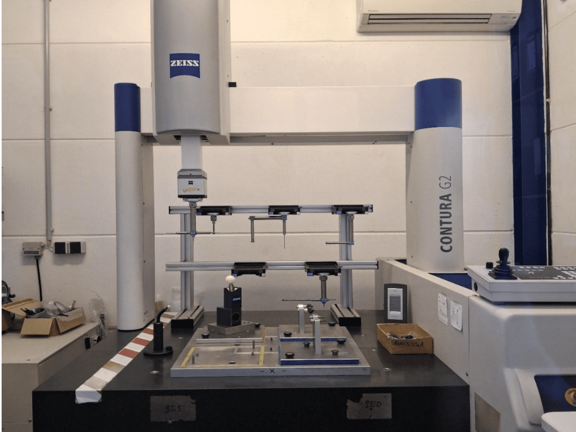 ZEISS Contura G2 CMM in a lab setting, showcasing the measuring apparatus and control panel from a front view.