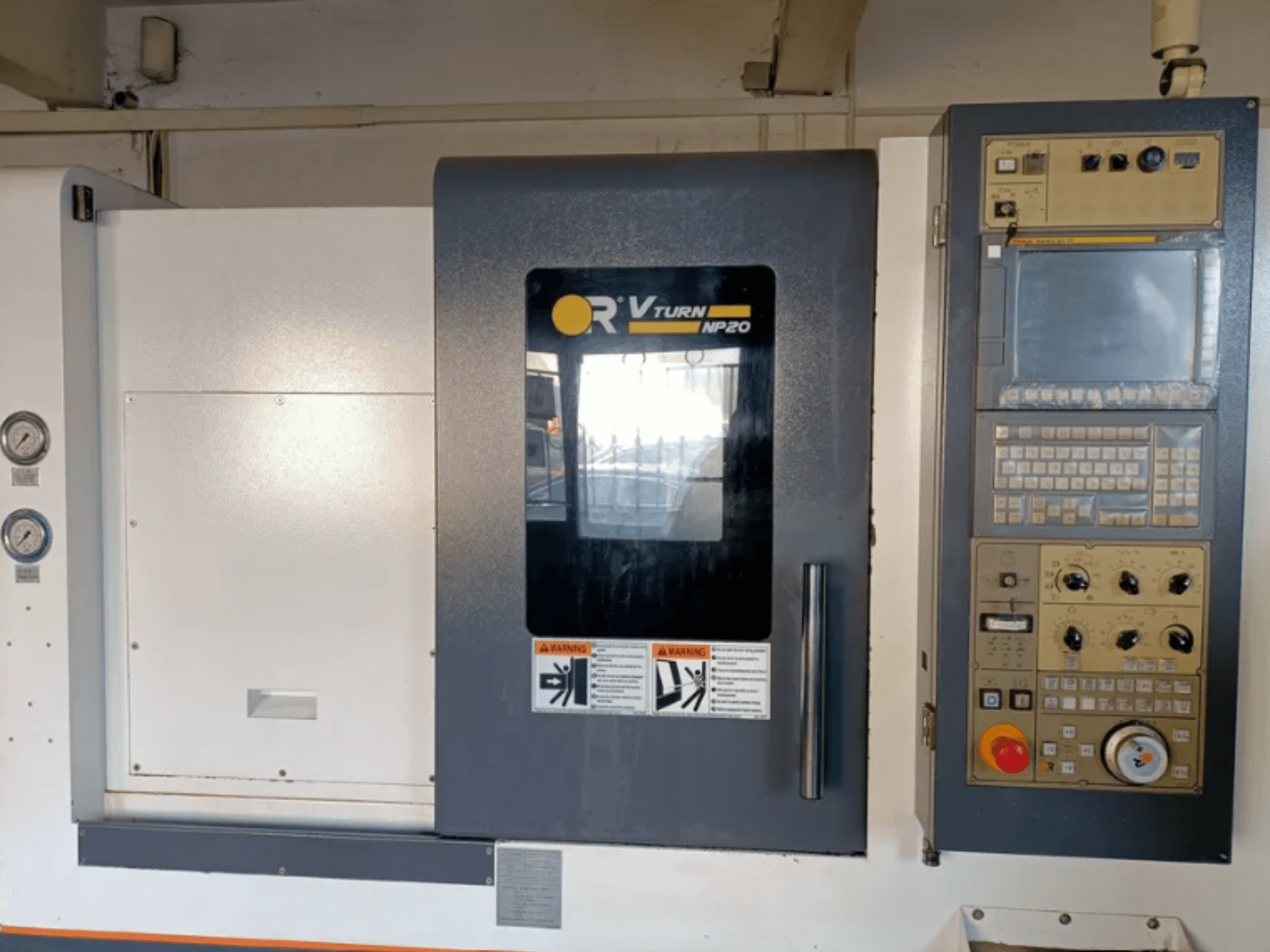 OR VTURN NP20 CNC machine front view, featuring control panel with buttons, display, and gauges on the side.