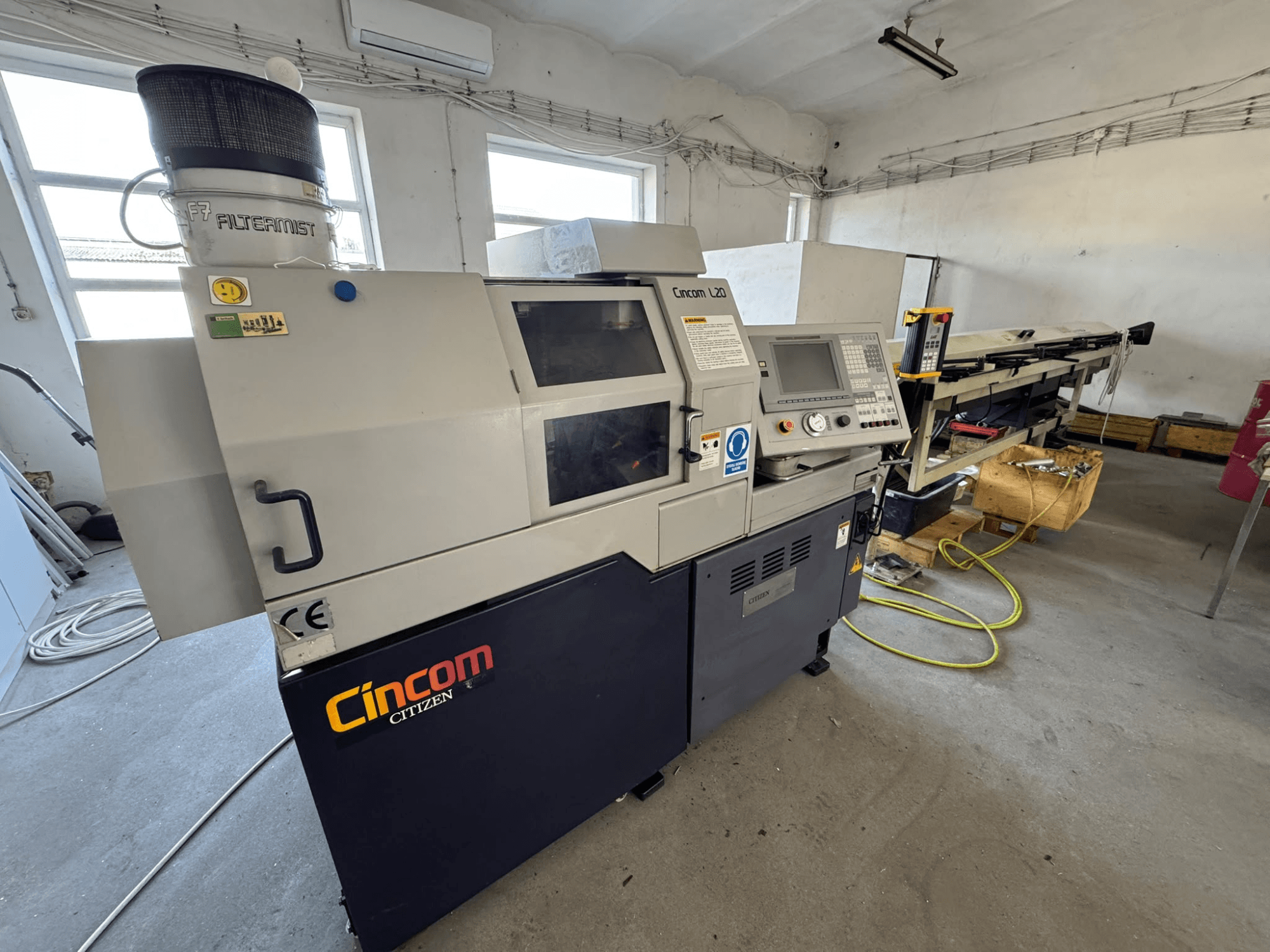Citizen Cincom L20 VII Swiss Type Turning Machine in front view, showcasing control panel and coolant system.