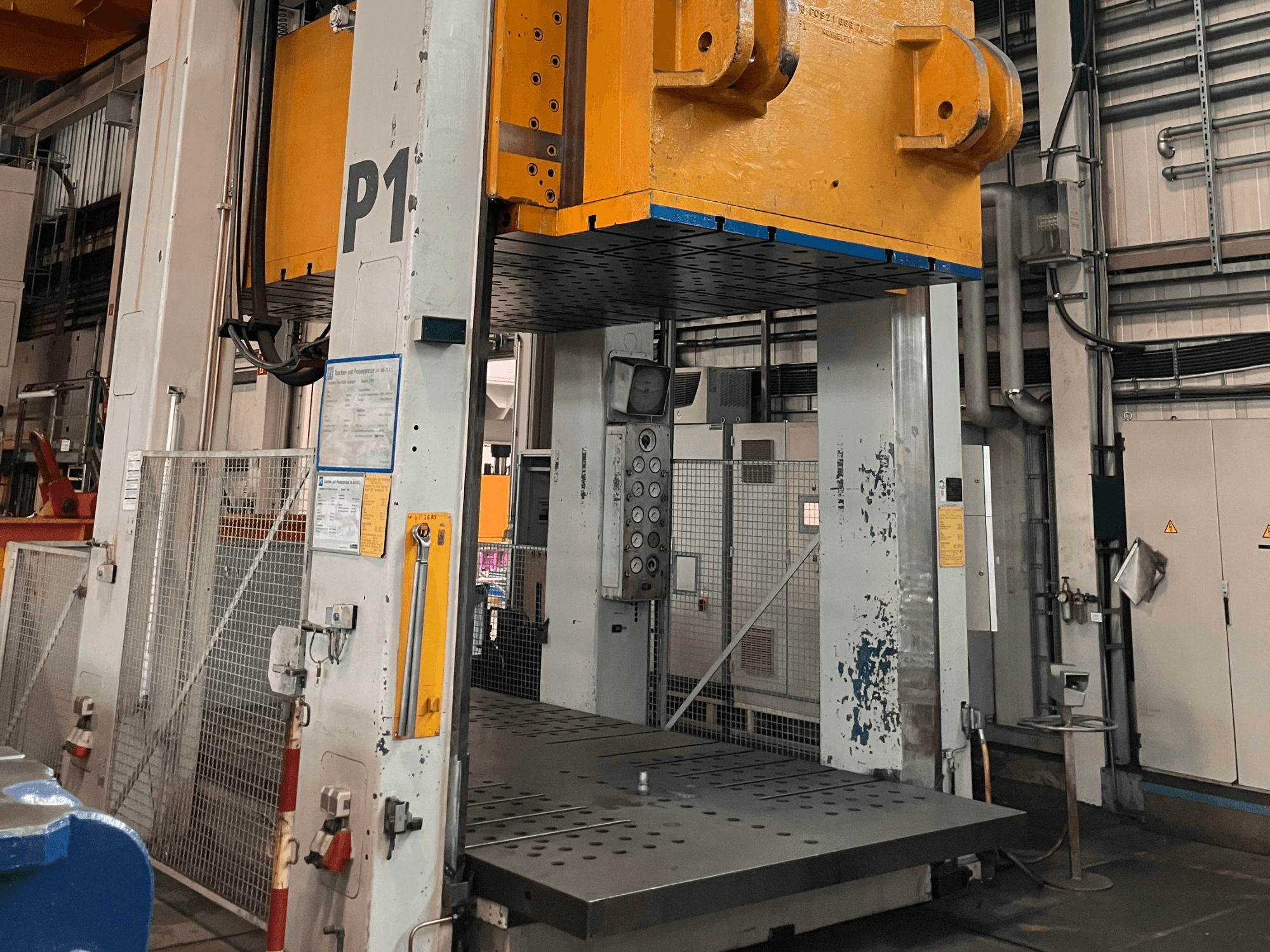 FRITZ MULLER ZAE 400-25.1.1 hydraulic press, front view, showing control panel and large press platform in industrial setting.