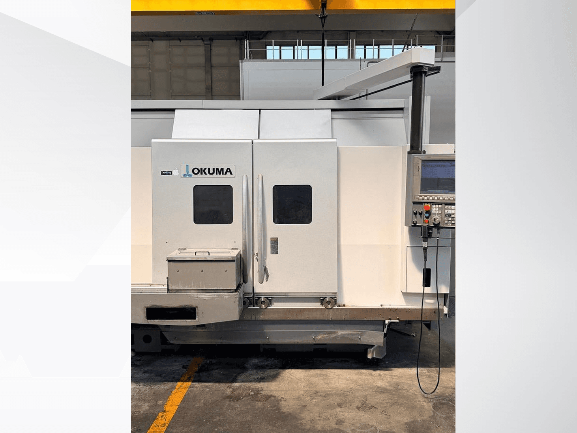 Okuma LB 3000 EX MYW 800 horizontal turning machine, side view, showing control panel and access doors.