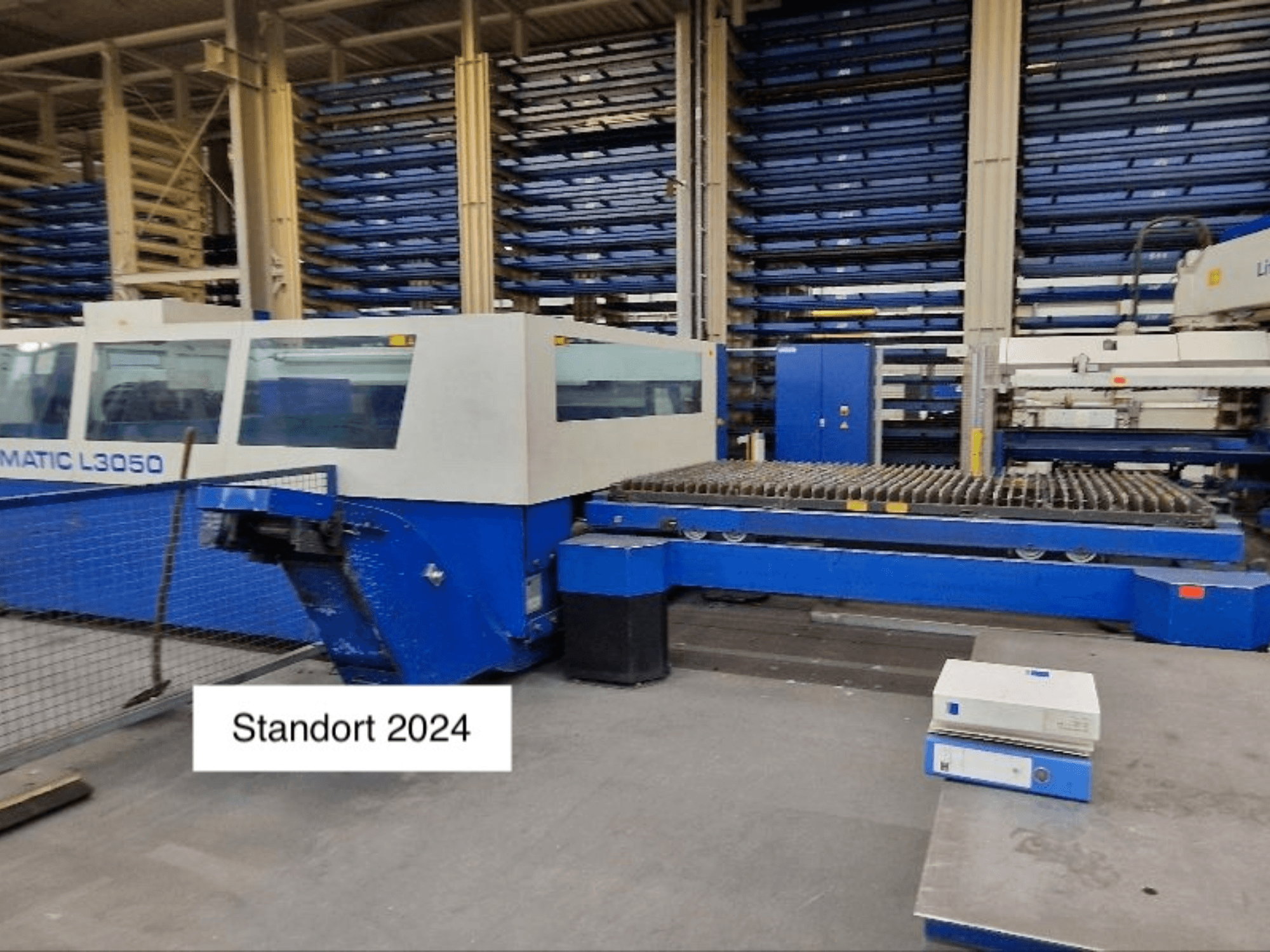 TRUMPF Trumatic L3050 CO2 laser cutting machine in a front view, featuring a large cutting bed and control panel.
