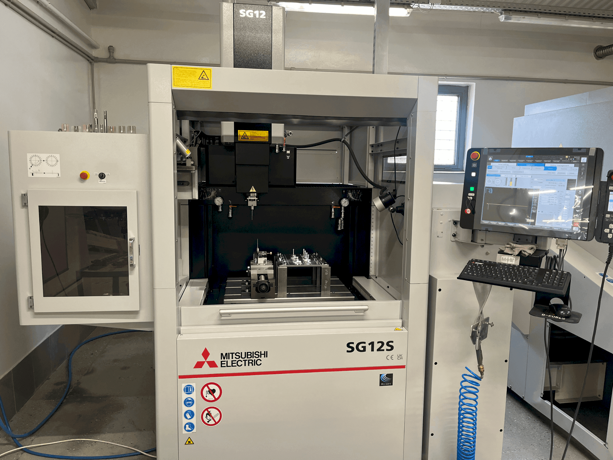 Front view of Mitsubishi SG12S machine