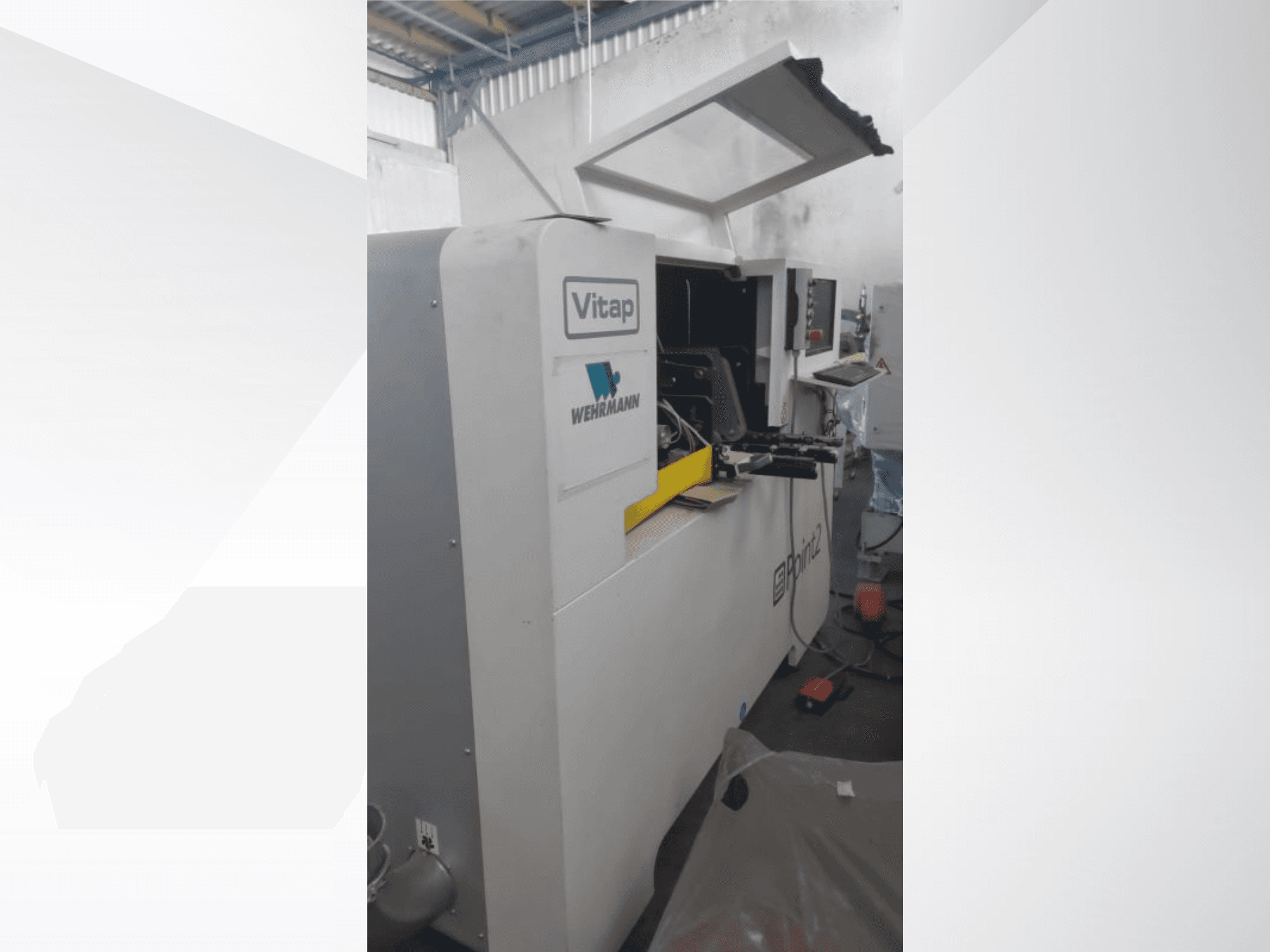 CNC Processing Center VITAP POINT 2 shown in side view, featuring operational panel and open cover for accessibility.
