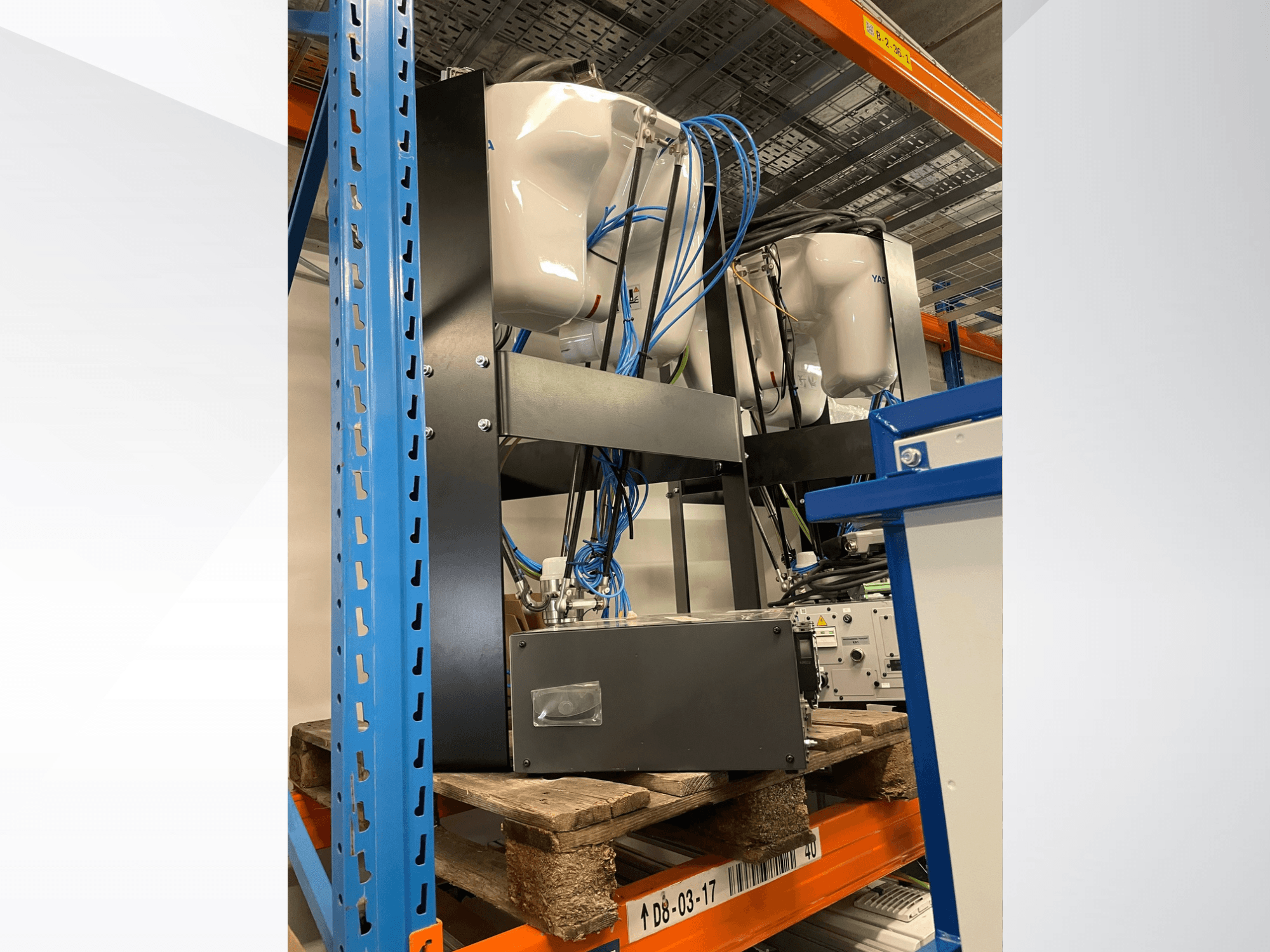 Yaskawa Motoman MPP3H robot arm, displayed in a side view, with wiring and components visible on a storage rack.