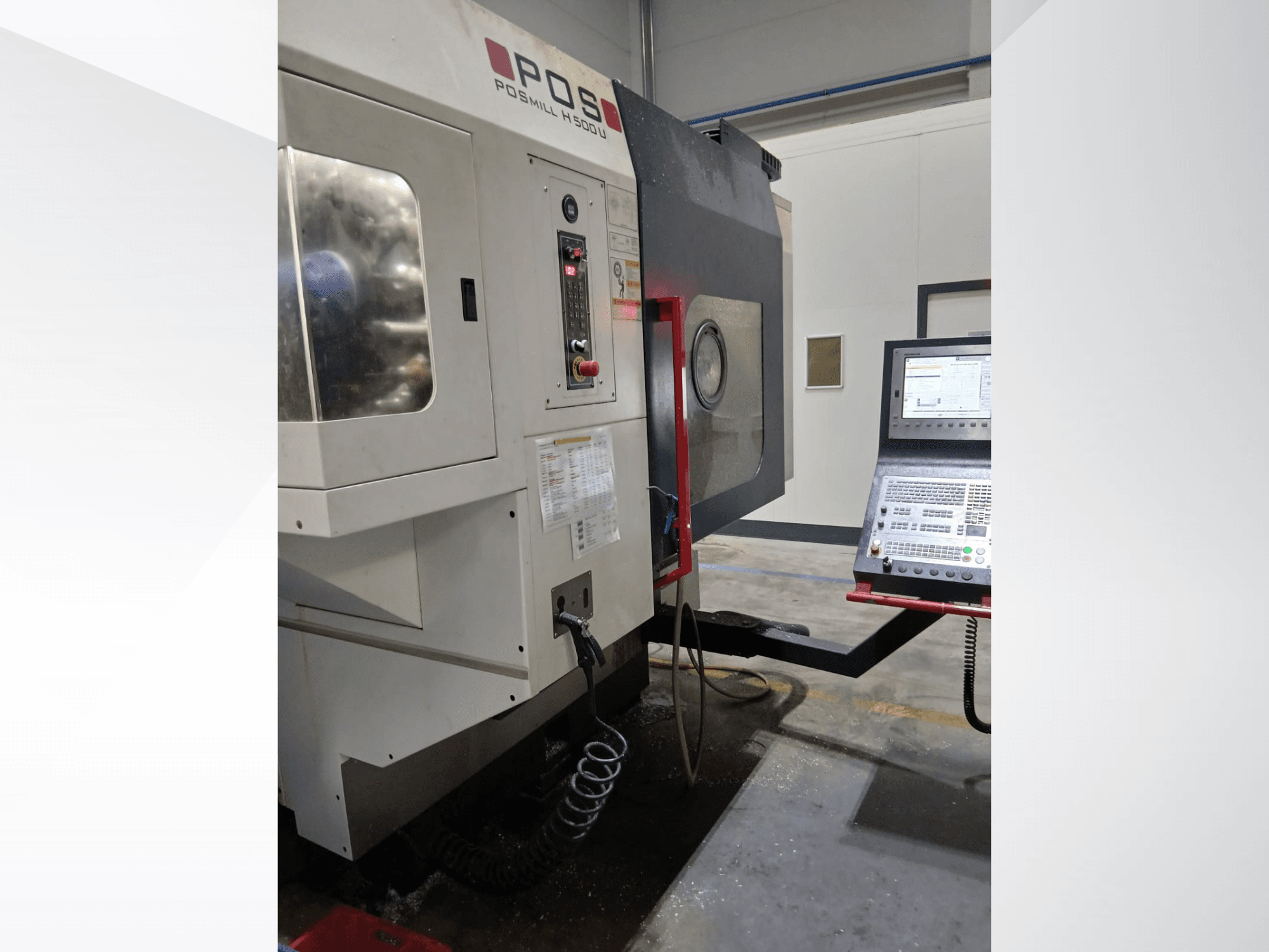 POSmill H 500 U vertical machining center in front view, featuring control panel and coolant hose, showcasing its industrial design.