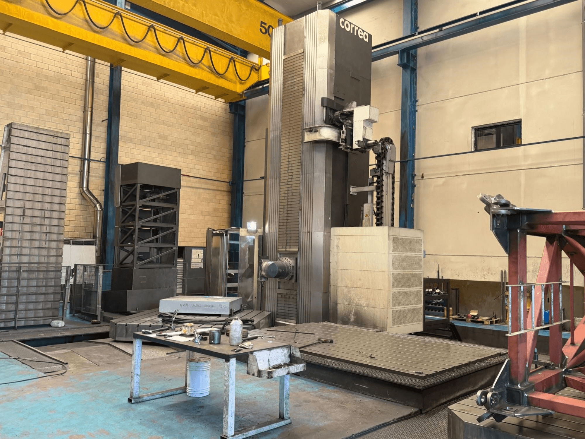 Correa SUPRA 135 universal machining center in a workshop, front view, showcasing the machine and workspace.