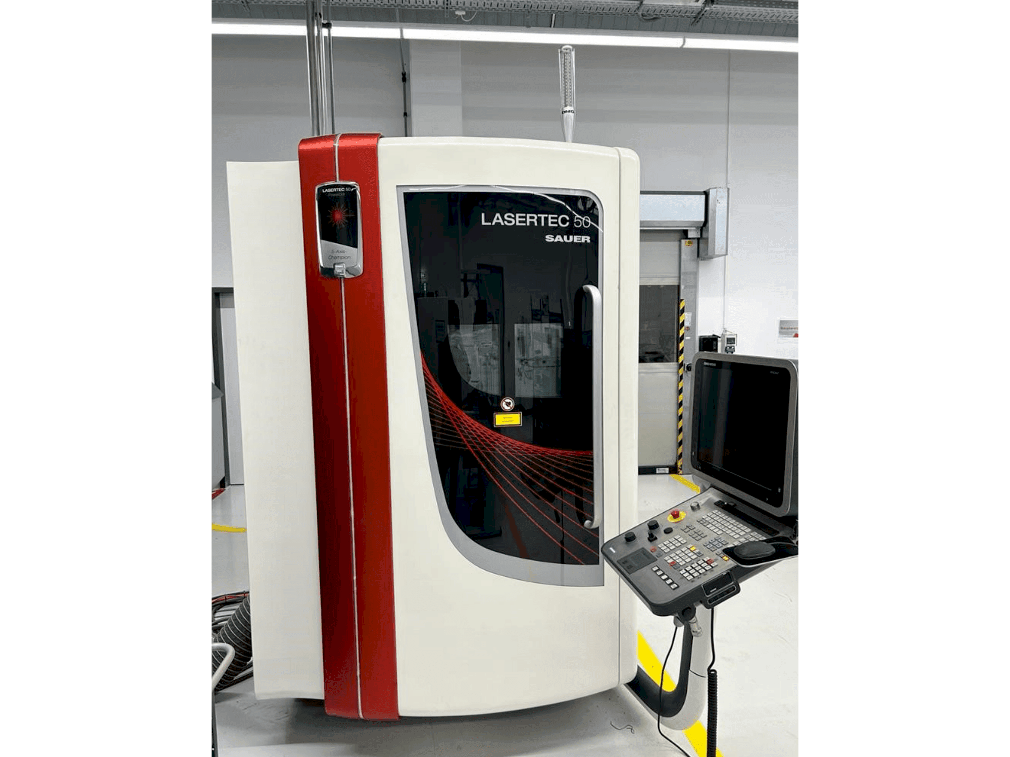 Front view of DMG SAUER LASERTEC 50 machine