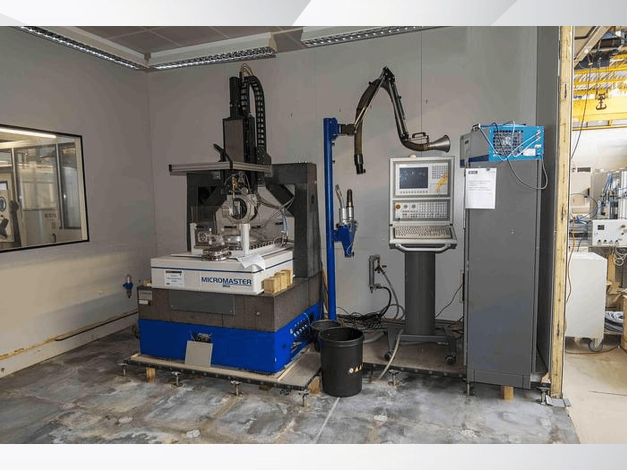 KUGLER Micromaster MG2 surface grinding machine in a workshop, front view with control panel and robotic arm nearby.