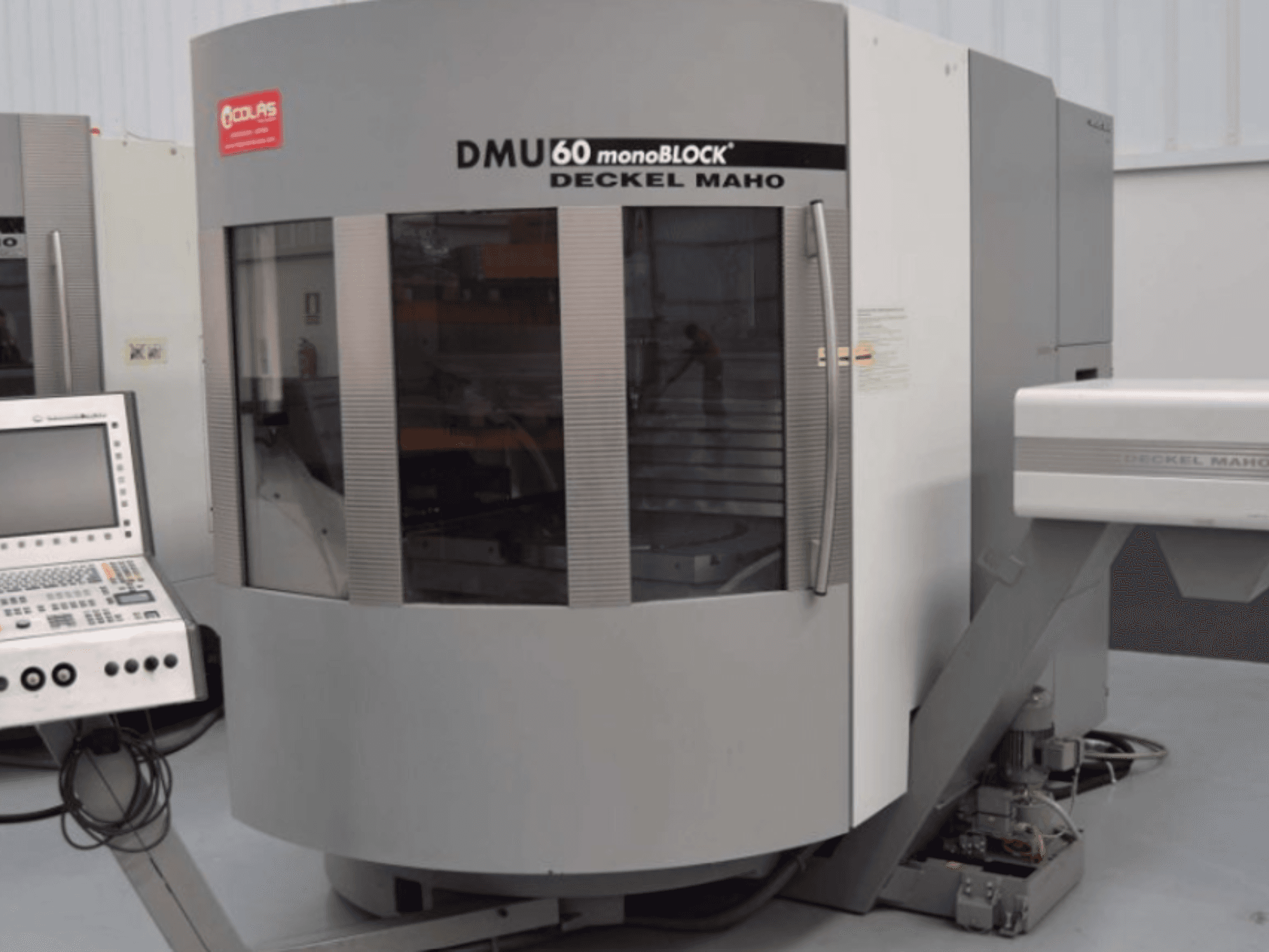 DMG DMU60 Monoblock vertical machining centre, shown from the front with control panel visible on the left.