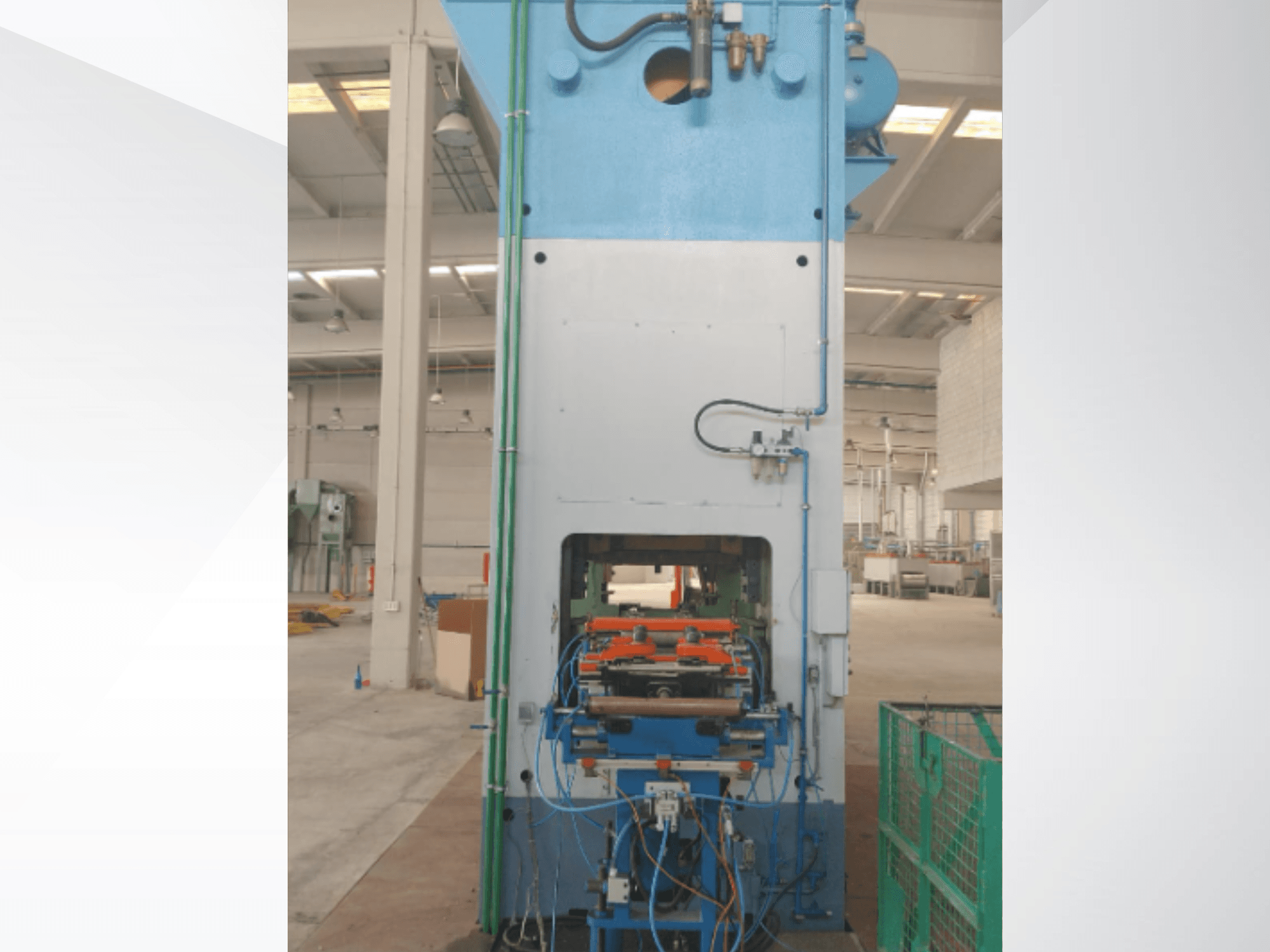 AIDA 315/2MR/LD/TE 3 mechanical stamping press, front view showcasing control panel and hydraulic lines in a factory setting.