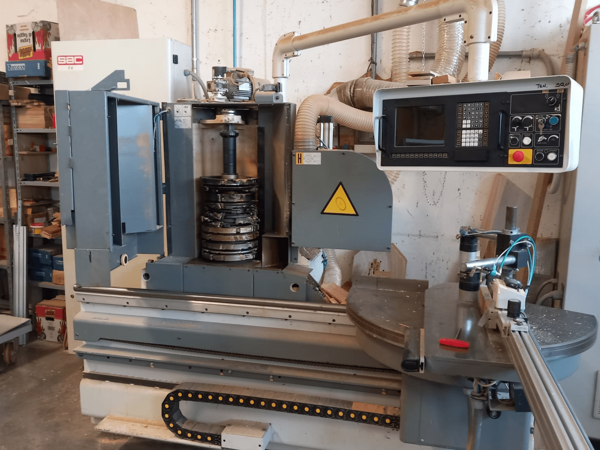 Front view of SAC T4TL wood machine with visible control panel, spinning tool holder, and dust extraction system.