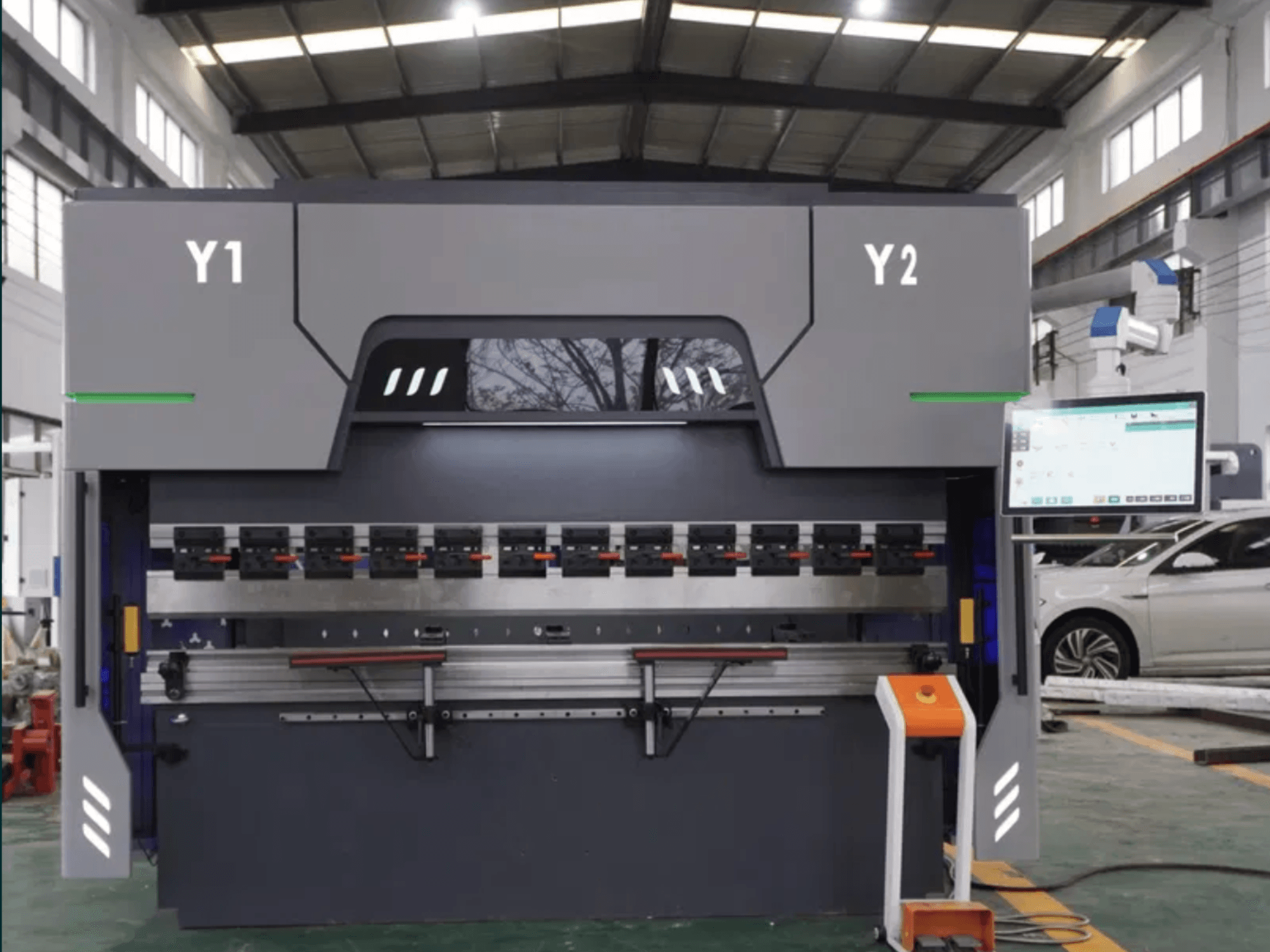 Front view of DAMAMT WC67K 63T/2500 CNC press brake, featuring control panel, bending tools, and metallic structure.