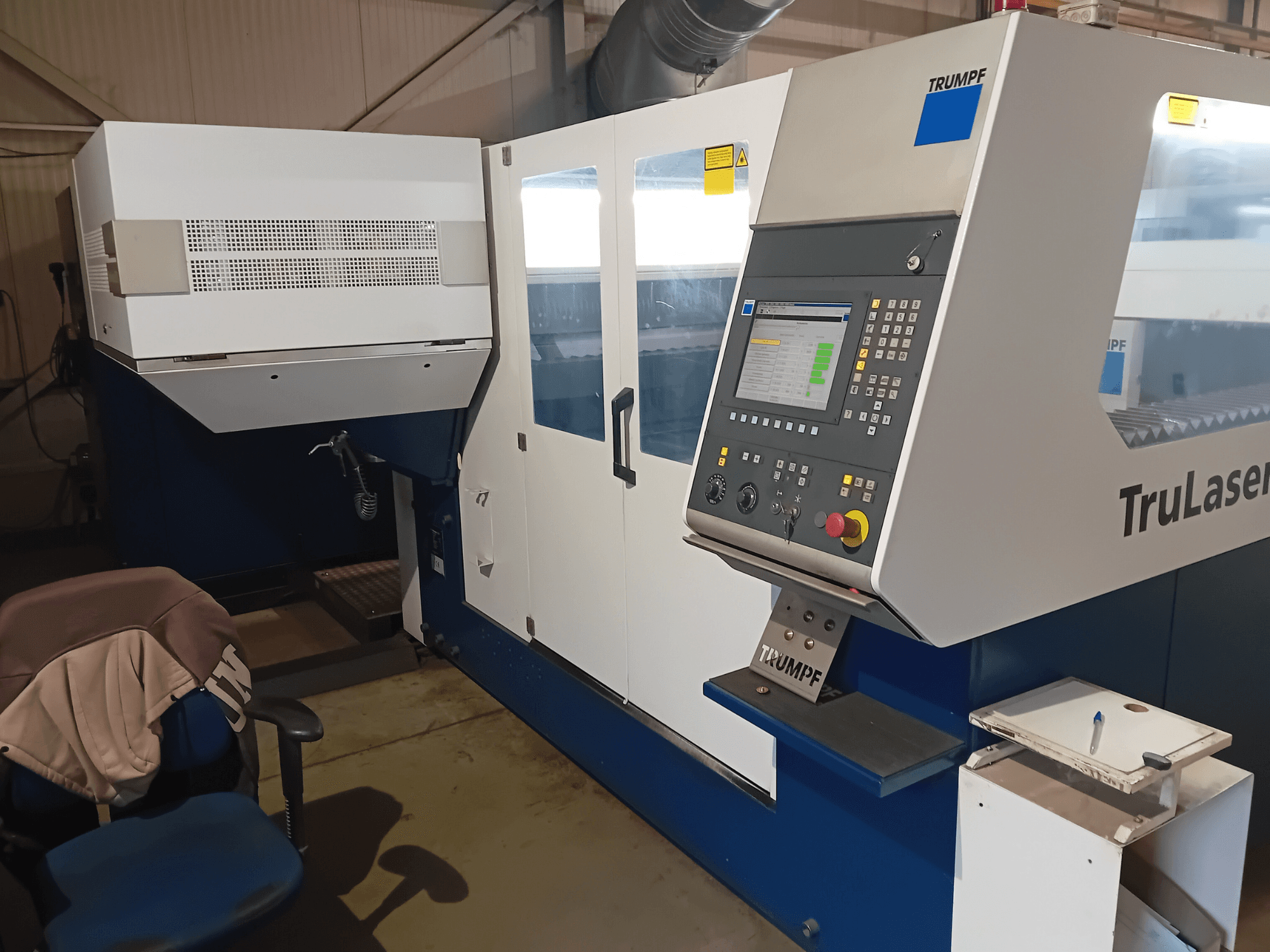 TRUMPF TruLaser 3030 CO2 laser cutting machine, front view, showing control panel and operator station.