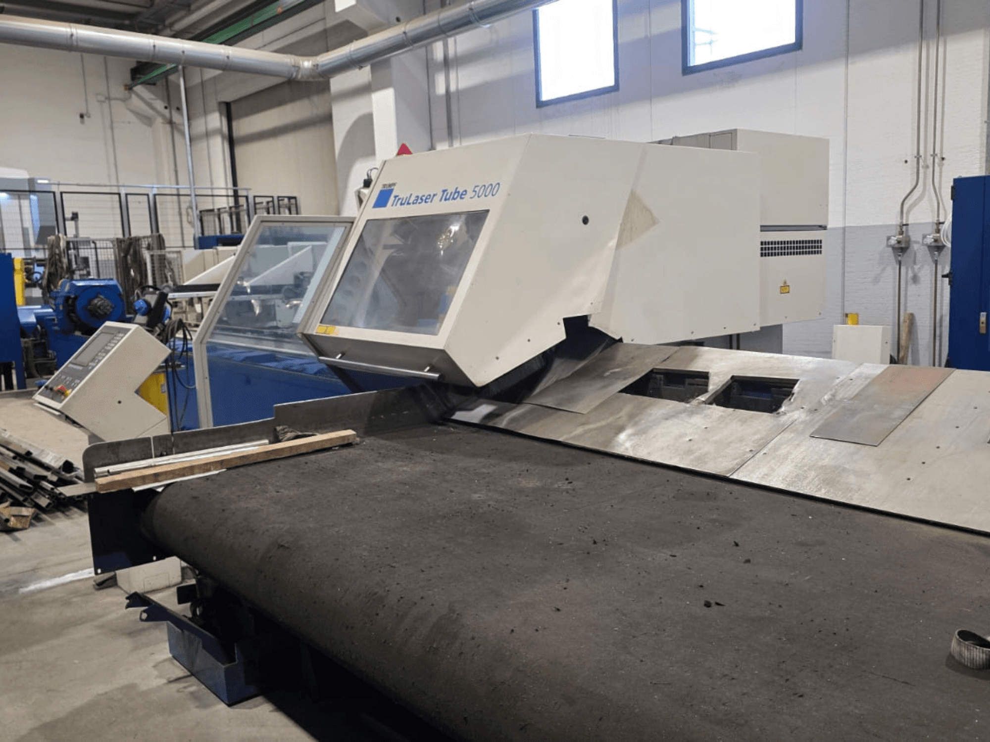 TRUMPF LASERTUBE 5000 tube cutting machine, viewed from the front, showcasing the cutting area and control panel.