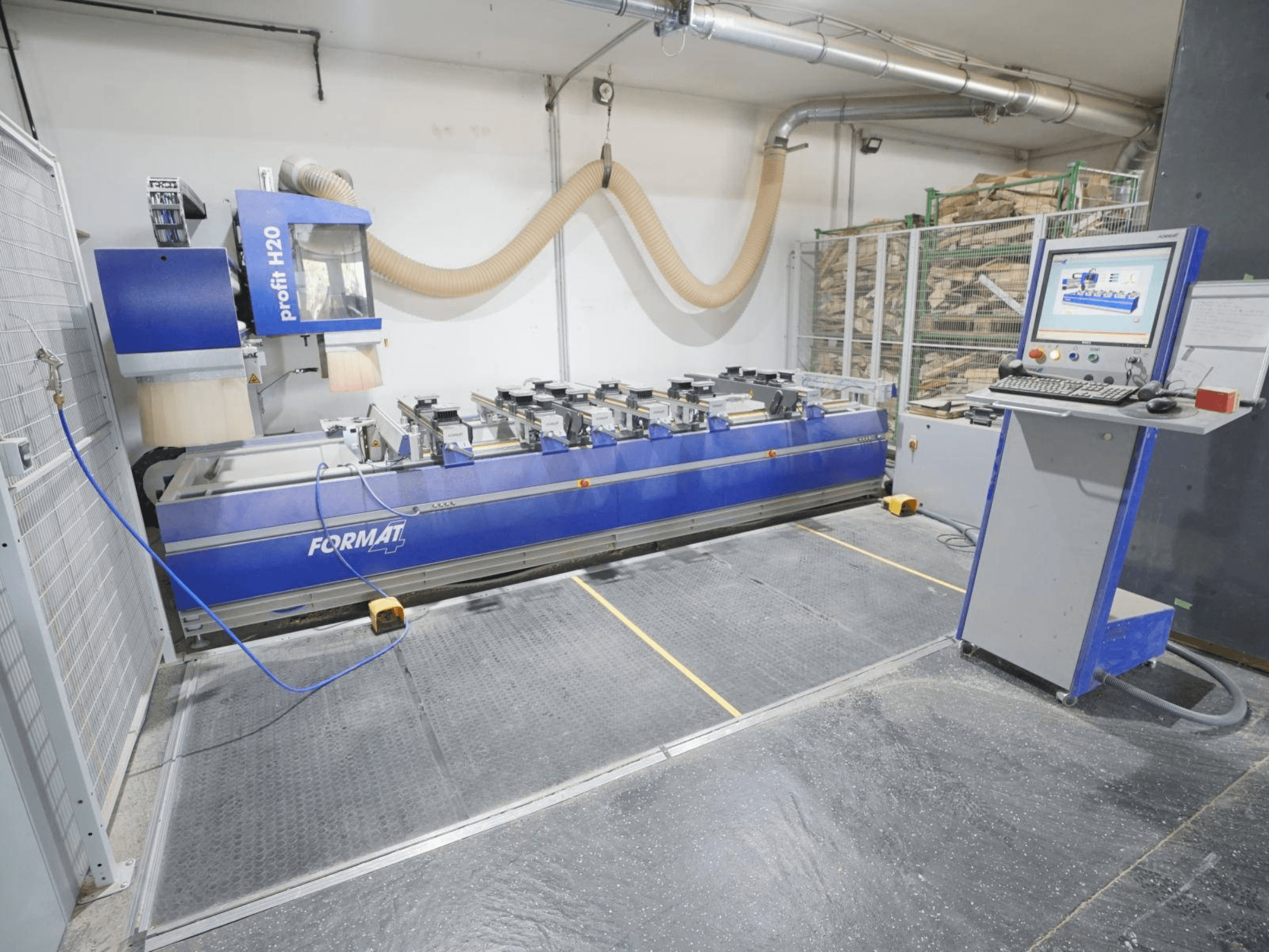CNC wood machining centre FORMAT4 PROFIT H20, front view with control panel and cutting tools visible in industrial setting.