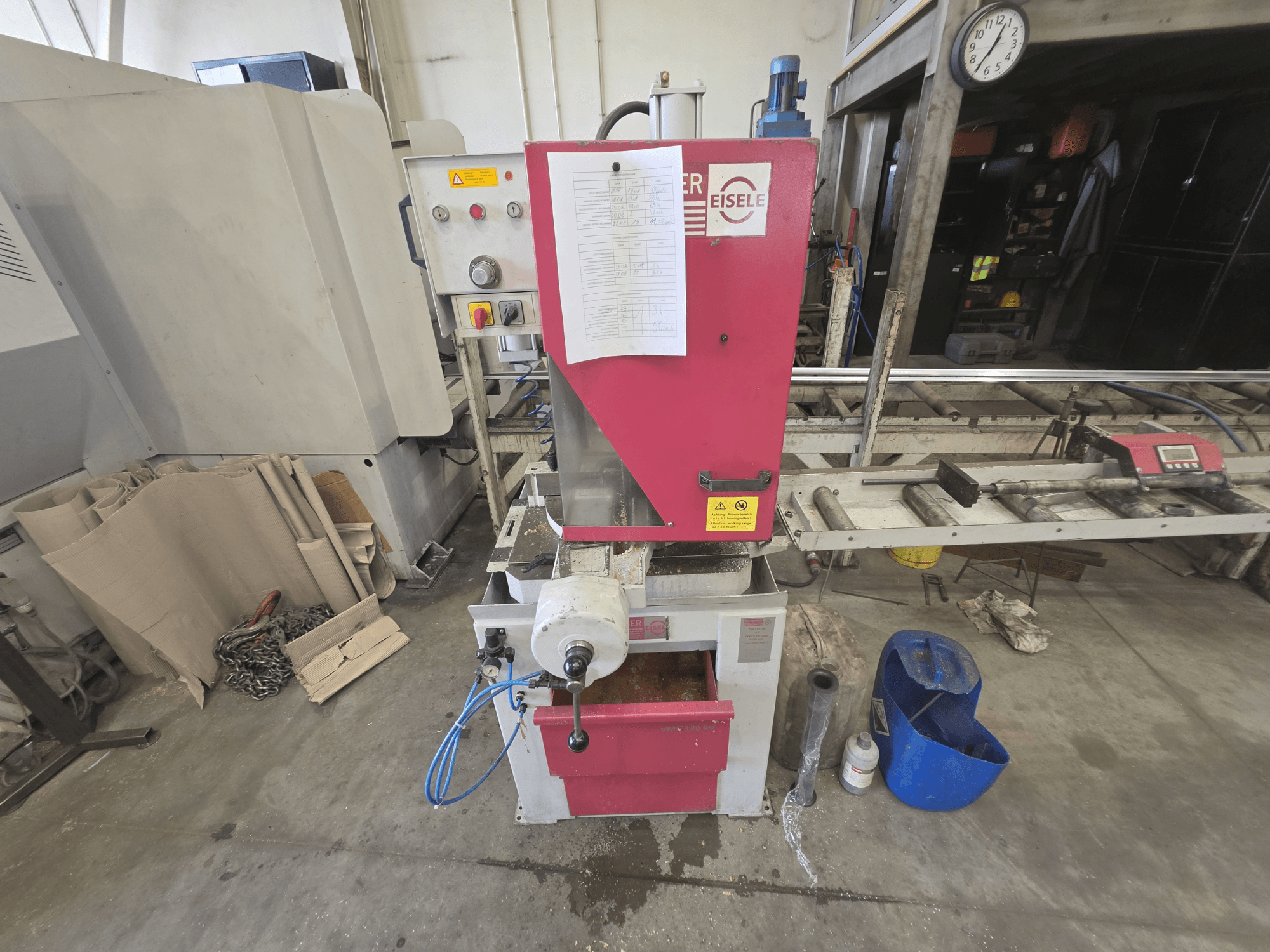 Behringer VMS 370 PV circular metal saw, front view, showing control panel, cutting mechanism, and workspace setup.