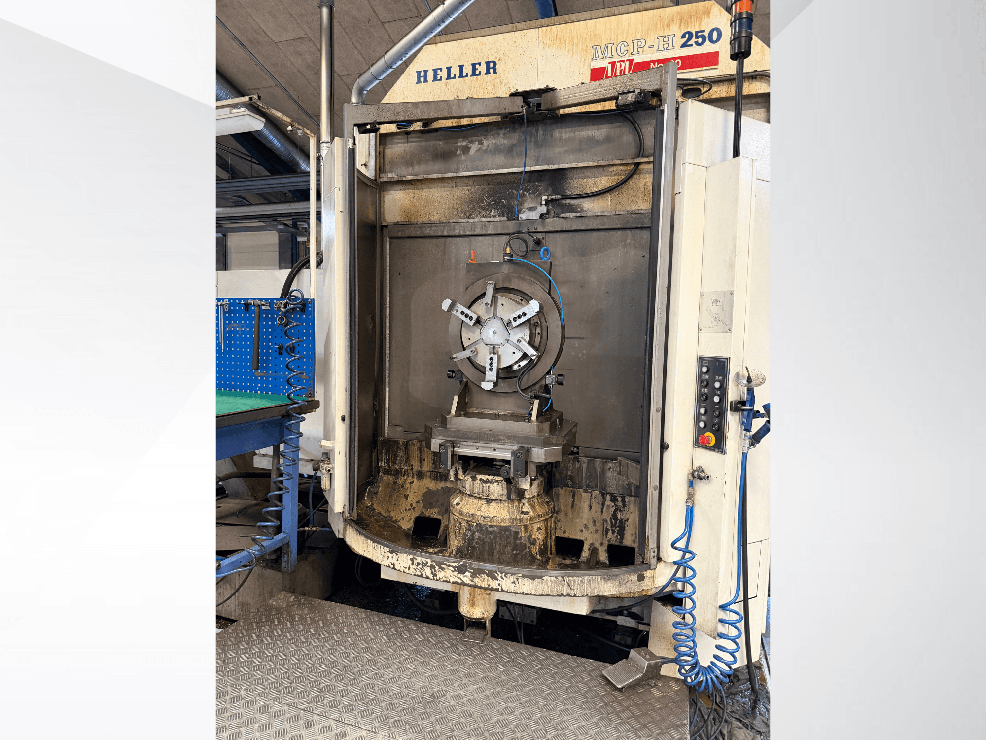 Front view of HELLER MCP 250 horizontal machining centre, showing control panel, work holding fixtures, and machining area.